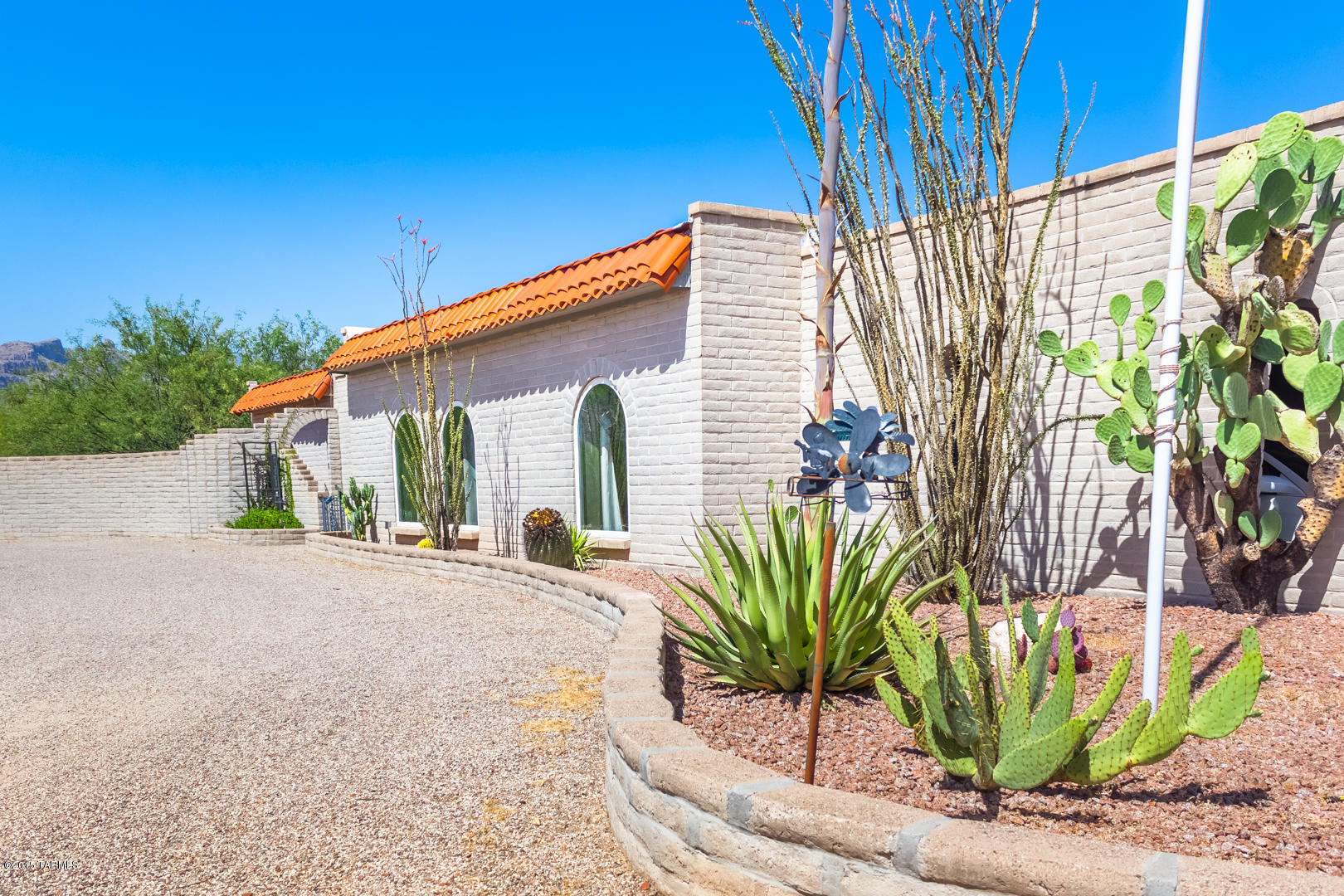 A CIRCULAR DRIVE LEADS UP TO A STUNNING REMODEL OF THE HIGHEST QUALITY WITH ATTENTION TO DETAIL.PRIVACY, DESERT VEGETATION & CATALINA MOUNTAIN VIEWS SET ON OVER 1 ACRE.BRIGHT,OPEN FLOOR PLAN WITH CUSTOM APPOINTED KITCHEN FEATURING DESIGNER SS APPLIANCES, BIRCH CABINETS, QUARTZ COUNTERS & CENTER ISLAND, GAS COOKTOP, TRAVERTINE BACK-SPLASH WITH TILE ACCENTS. KITCHEN OPENS TO  FAMILY ROOM THAT BOASTS COZY FIREPLACE ,CHERRY-WOOD HARDWOOD FLOORS ,  FORMAL DINING ROOM,FLOWS INTO FORMAL SITTING AREA  ,4 BEDROOMS , MASTER WITH GRACIOUS UPDATED BATH , WALKIN SHOWER ,DOUBLE VANITY, SKYLIGHTS AND  CEILING FANS THROUGHOUT,OVER-SIZED LAUNDRY ROOM , STEP OUTSIDE THROUGH CUSTOM FRENCH DOORS TO A RESORT-LIKE BKYD W/SPARKLING POOL, FULLY-WALLED ,COVERED PATIO,HORSE PROPERTY.
