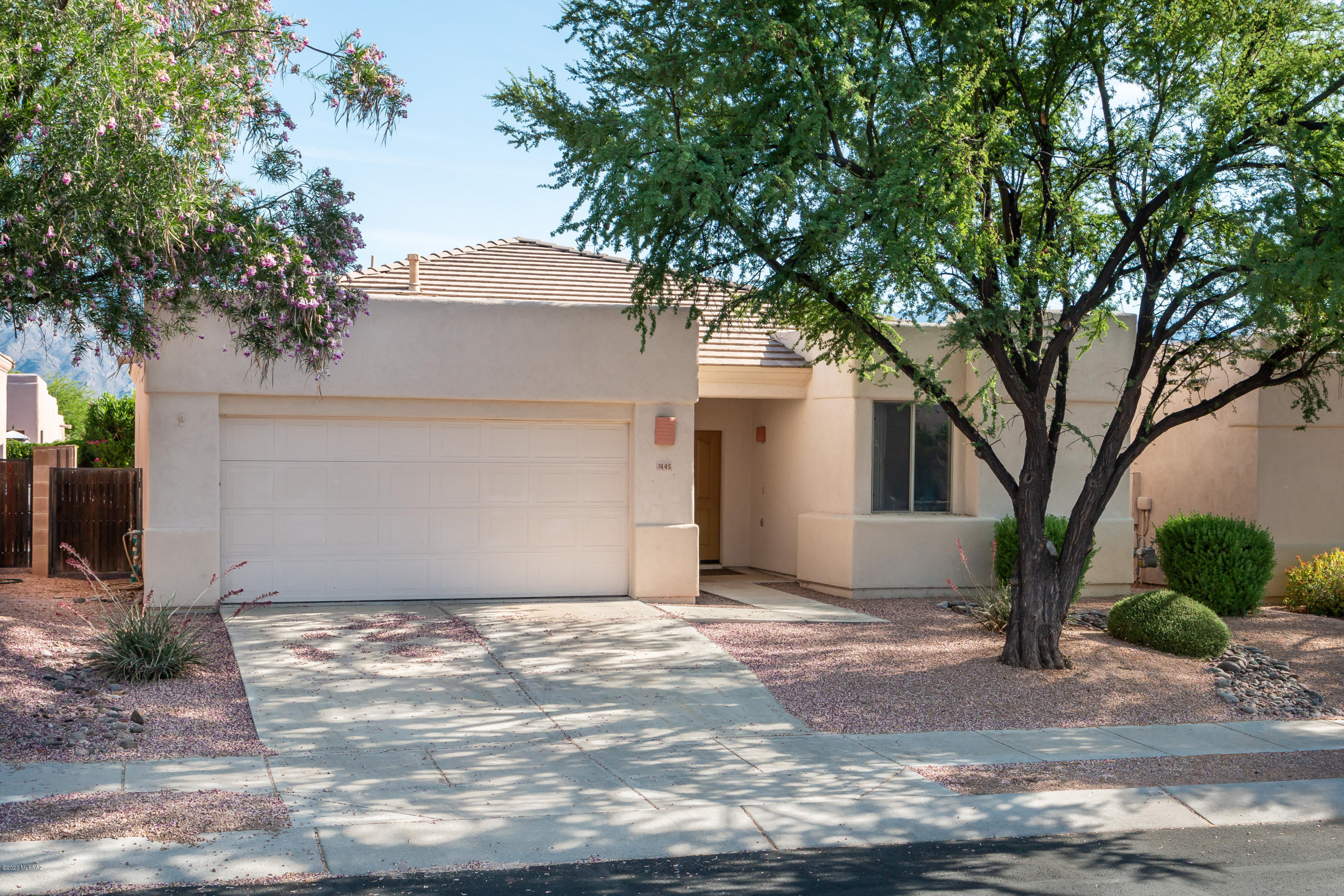 Spacious 3 bed, 2 bath split floor plan home in the popular gated community of Rancho Esperero! The open living space offers an abundance of natural light, low maintenance laminate wood floors throughout, and gas hookups to all of the appliances! The large master suite includes an en suite bath with a huge walk-in closet and private access to the backyard. This gated community offers a community pool and spa, is close to parks, shopping, restaurants - and is only a short drive to Sabino Canyon and Mt. Lemmon.