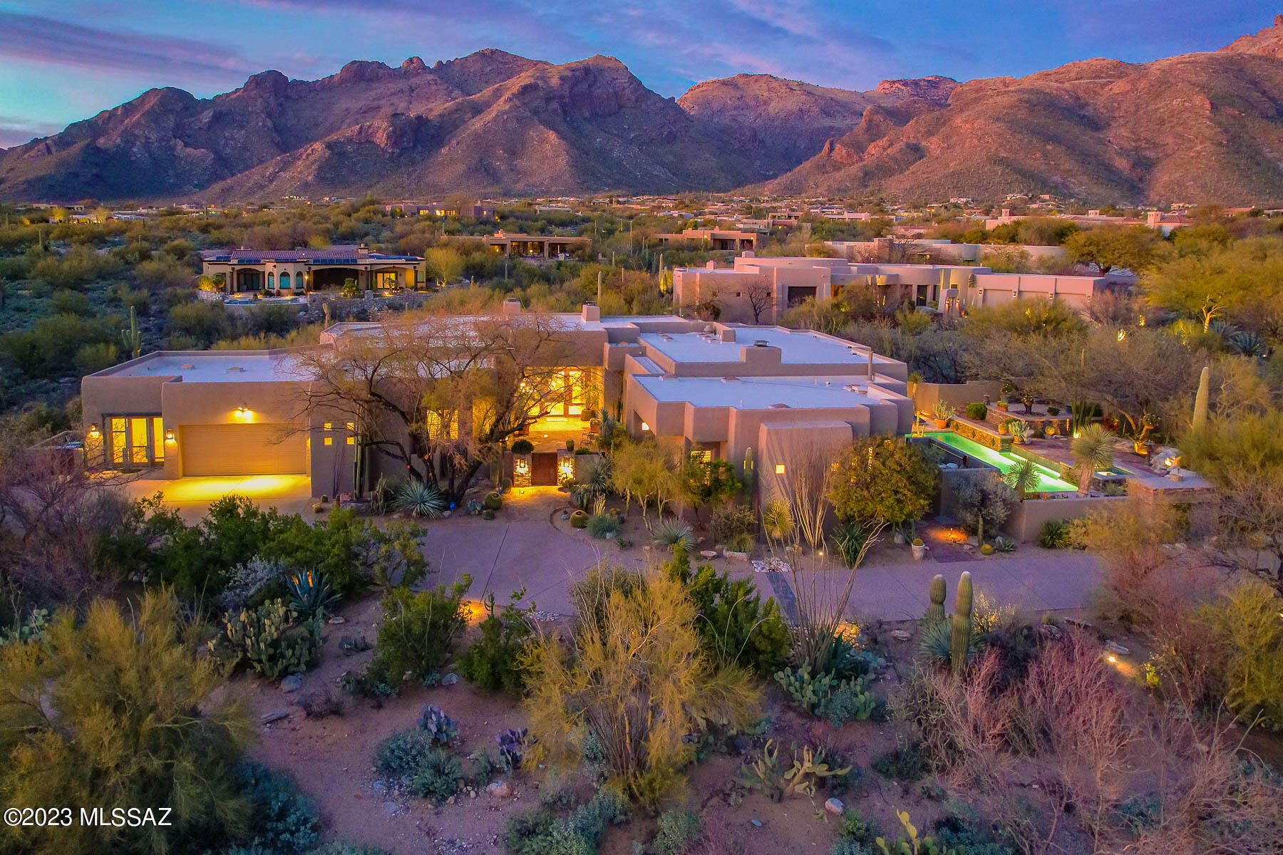 Welcome to this stunning SW contemporary home located in the highly coveted gated Pima Canyon Estates.  With 5371 square feet of living space, this luxurious property features spacious primary suite with additional 3 bedrooms, each with their own en-suite bathrooms, as well as office and exercise studio.

The moment you step inside, you'll be awed by the breathtaking panoramic Catalina Mountains views from almost every room.  The open floor plan seamlessly blends indoor and outdoor living, creating an inviting atmosphere perfect for entertaining guests.

The gourmet kitchen is a chef's dream come true, complete with a  100+ bottle Sub-Zero wine refrigerator, 48'' Viking range, 2 dishwashers, expansive granite island, and wet bar with beverage refrig. Enjoy the spectacular Arizona weather with 1000 square feet of private patios that boast two fireplaces, pool/spa with water feature, fountain, and an outdoor kitchen that is perfect for grilling and dining al fresco!

This home is ideally located in one of the most sought-after communities in Tucson and is just a short distance away from world-class golf, shopping and dining options