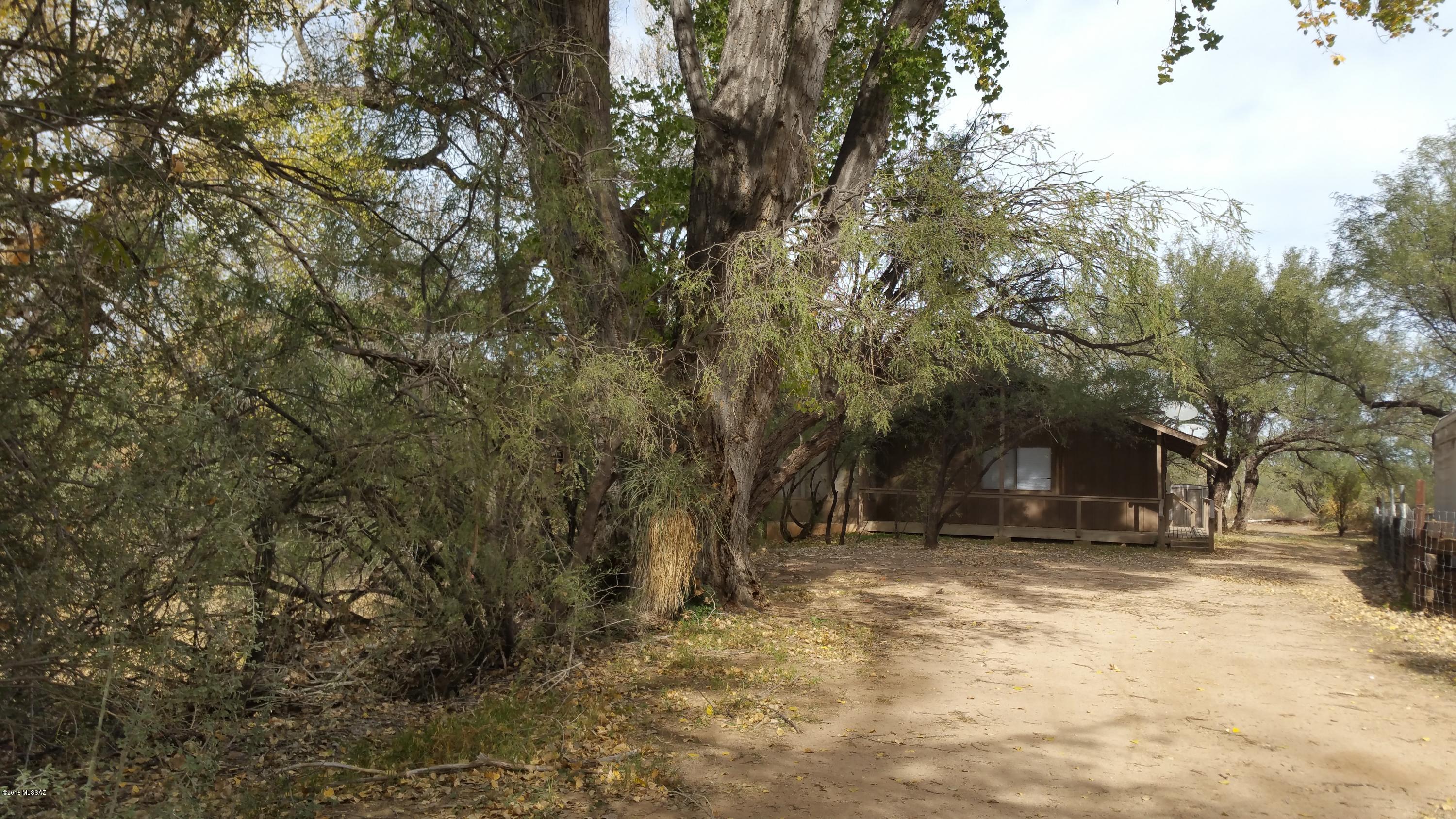 Great 3Bdrm, 2Bath hideaway tucked in amongst the mesquites and parallels an irrigation ditch, which offers huge Cottonwoods and the sound of running water. Set in, off the road, makes it feel like a cabin in the woods. New Roof and Septic system in 2013.Plumbing and Heating upgrades also in 2013. More plumbing and renovations in 2018. Move in ready, Located in St. David Townsite. Close to Tombstone, Benson and Tucson.