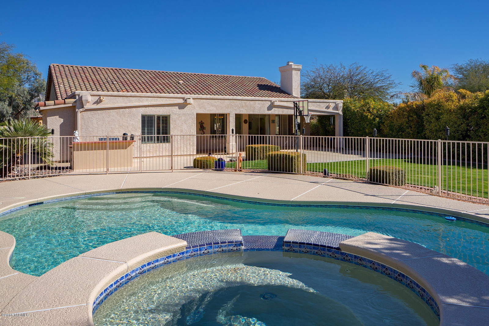 This beautiful 1-story home has it all! POOL, SPA, 3-CAR GARAGE, 4 BEDROOMS, 2 BATHS IN GATED COMMUNITY. Let's start with the amazing backyard with heated spa that flows into the pool, green grass, built in BBQ & extended patio. Large kitchen with granite counters, lots of cabinets, pantry, built-in microwave & breakfast area. Kitchen opens up to a family room with soaring ceilings and gas fireplace. Separate living room & dining room. Master bedroom has an additional office area with built-in desk, cabinets & closet. Master bath has shower, garden tub, dual sinks & a huge walk-in closet. This prime 1/3 acre lot provides maximum privacy with tall bushes on both sides. New carpet, freshly painted and move-in ready. Gated Community with parks, lakes, fitness center, rec center & more. Neighborhood provides a unique setting with tall trees, 14 lakes, grass parks, heated community pool, fitness center, rec center and playground.