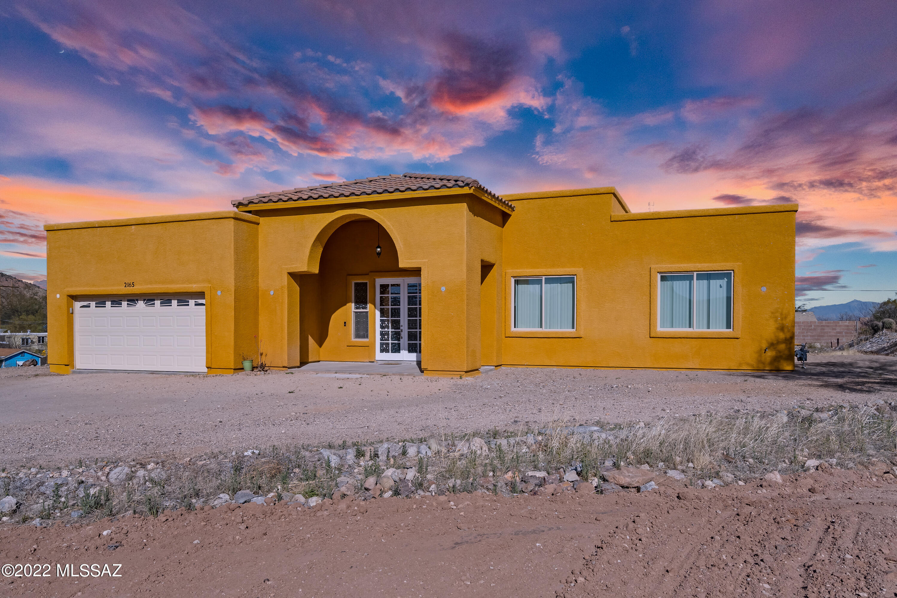 Custom Built Home built in 2018 with amazing views of the Tucson Mountains. Gourmet kitchen with Granite Countertops, SS Appliances and lots of cabinets. Luxurious Master bedroom with walk in closet, spa tub and separate shower. The 3 additional bedrooms are large sized. This home is perfect for entertaining. Enjoy the Sunrise and Sunset views.