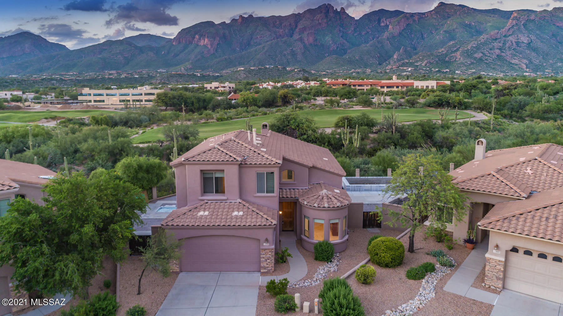 Sited on a premium elevated lot in the prestigious gated community, The Villages of La Paloma, this stunning 2425-sq. ft. Southwest contemporary home showcases sweeping, unobstructed Catalina Mountain views. Features abound in this open & airy floorplan with soaring ceilings, multiple windows allowing an abundance of natural light, Turkish Travertine flooring throughout, & spacious great room with fireplace. Enjoy Chef's kitchen with granite counters, breakfast nook, pantry, & views of Catalina Mountains. Retreat to main-level Owner's Suite with private access to covered patio. 
Entertain in 3 oversized backyard areas featuring interlaced cobblestone patio surrounding Linac Marble negative-edge saltwater pool, recently updated with Pentair pumps & heater, sunken spa, & panoramic views.