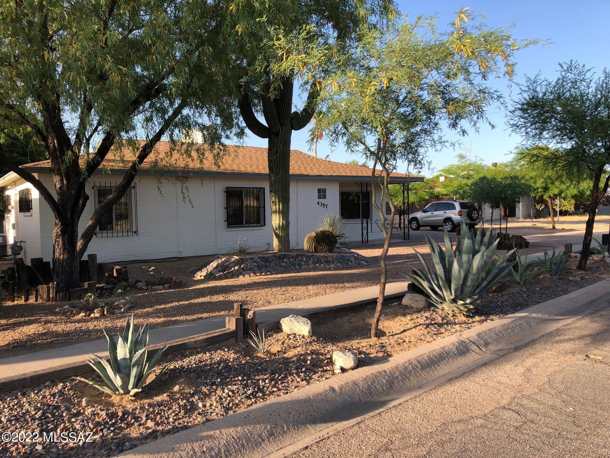 Don't miss this 3 bed 1 bath charmer in desirable central Tucson. A beautiful home with masonry construction, open floor plan & natural light. Upgrades include new interior & exterior doors, fresh paint inside & out, ceramic tile, dual pane windows, ceiling fans, kitchen skylight, garbage disposal, glass top range, cabinets & pantry,  recessed refrigerator, Mexican tiled bar & recessed lighting, rustic wood feature in dining area, Mexican tile accents in bath, extra attic insulation & ice-cold AC. Exterior features low water desert landscaping, mature shade trees, huge backyard, room for a studio or workshop, block wall with a 12' gate, covered patio & attached storage room, washer dryer closet, security lights, wrought iron doors & window guards. A must see, with great bones & good vibes!
