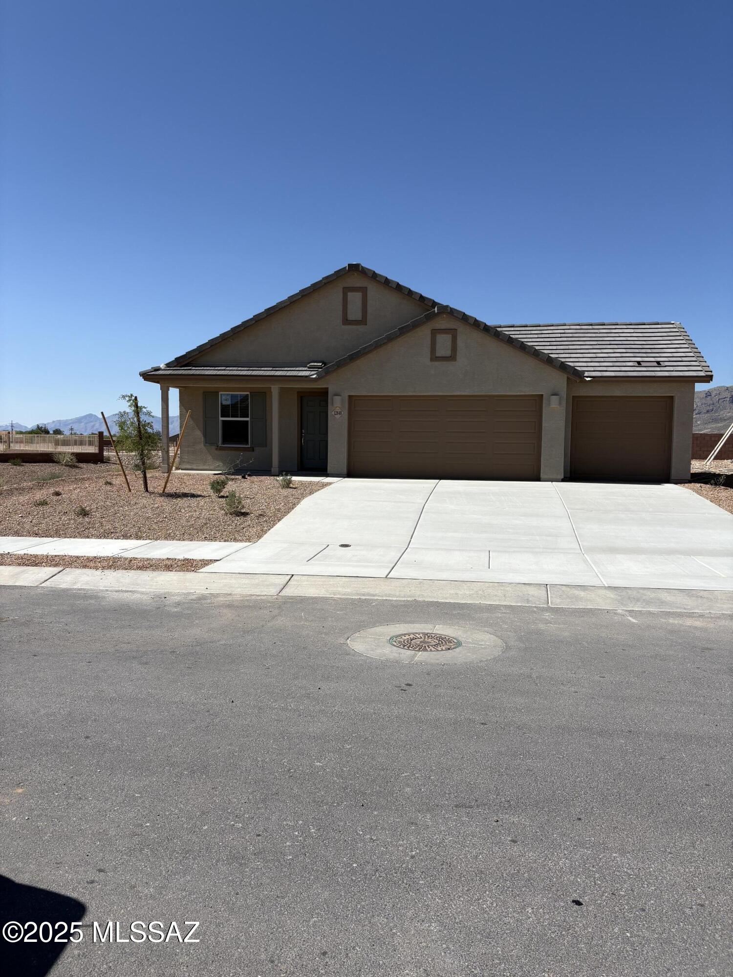 This new single-story home features a modern layout with an open floorplan consisting of a stylish kitchen, a dining nook and the Great Room, with a patio offering seamless indoor-outdoor transitions. Three bedrooms are tucked away to the side of the home for optimal privacy, including the spacious owner's suite. Residents will enjoy additional storage space and convenient parking with a three-bay garage. This home includes GE® stainless steal appliances, Rinnai Tankless Water Heater, Granite Countertops, Taexx® built-in pest control system, 2'' faux wood blinds, LED lighting and so much more!