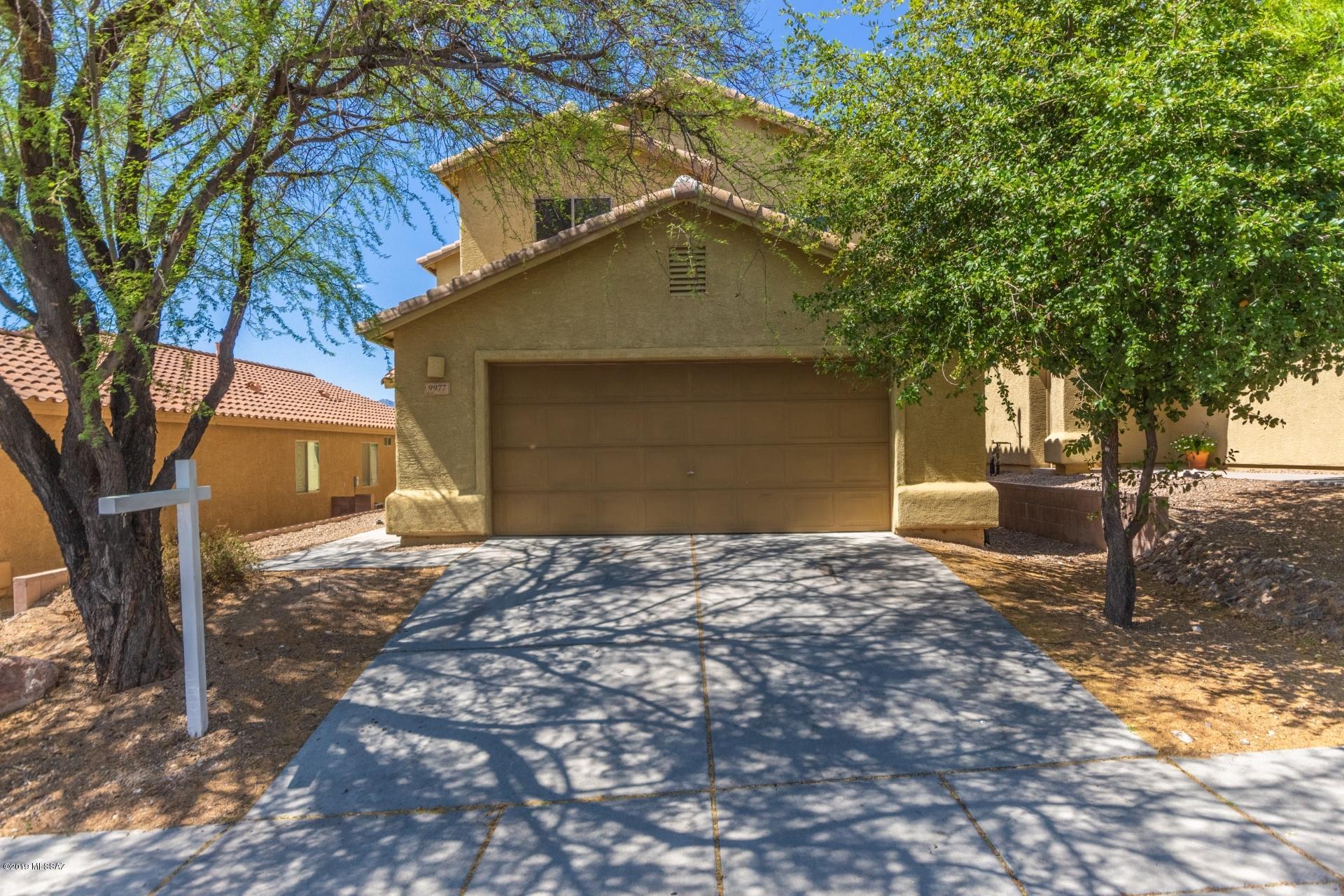 Fantastic 2 story home that sits nestled in the incredible city of Tucson! Upon entering this home, you are presented with gorgeous tile flooring, earth tone paint palettes and an open floor concept! The kitchen features a breakfast bar, lovely laminate countertops, SS appliances, plant shelving and warm wood cabinetry. The spacious bedrooms offer plenty of room for sleep, study and storage. Upstairs, you will find the loft area that offers endless possibilities! The master bathroom showcases dual sinks, walkin closet, walkin shower and warm wood cabinetry. The covered back patio overlooks the expansive backyard that is truly a blank canvas that is ready for your personal touch! Don't wait on this one! Make your move and book your showing today! This great home won't last!