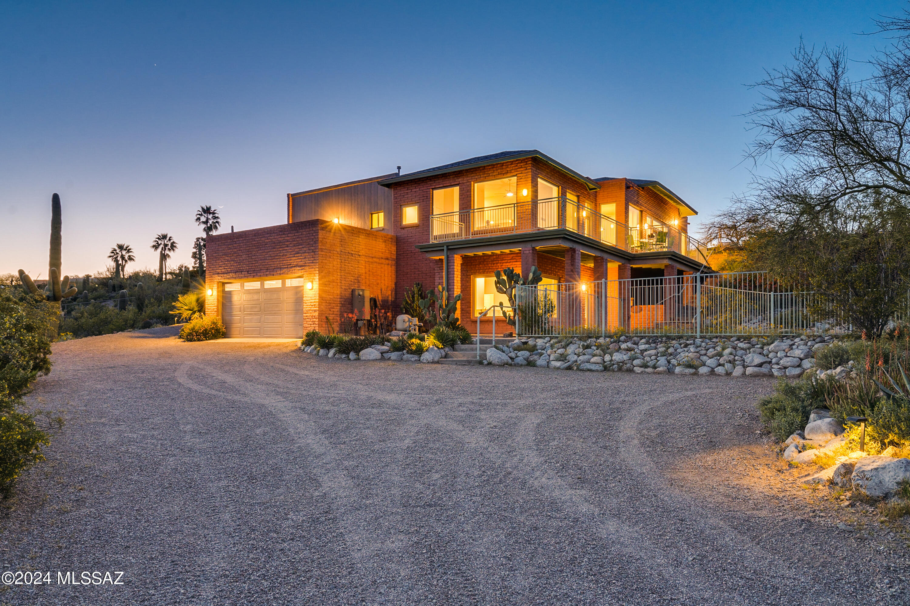 This stunning contemporary, 4 bedroom, 4.5 bath main home is nestled on saguaro covered hillside with panoramic views, & only minutes from downtown. 
Located at the end of the road, this gated & fully fenced 2.9 acre property boasts a multi-level main house, pool, large garage/workshop & a totally separate horse facility with guest quarters. With ample space for relaxation & recreation, this home is truly a haven for those seeking the finest in Westside living. 
Step inside to discover a natural light filled open floor plan with breathtaking panoramic views through all new oversized windows and doors. 
Retreat to the secluded primary suite with its own private patio, surrounded by amazing views & lush desert landscape. Relax on the deck overlooking the sparkling pool, set just outside the huge lower level game room with its own full bath.
The 5 stall horse barn is absolutely fantastic. Each stall has its own lockable tack storage area, large turnouts & a nice riding arena.
The barn also features a charming studio with a full bathroom and kitchen and a large 2nd floor area that can be configured as additional living quarters, exercise room, office, etc. Nearby trails to Sweetwater preserve!