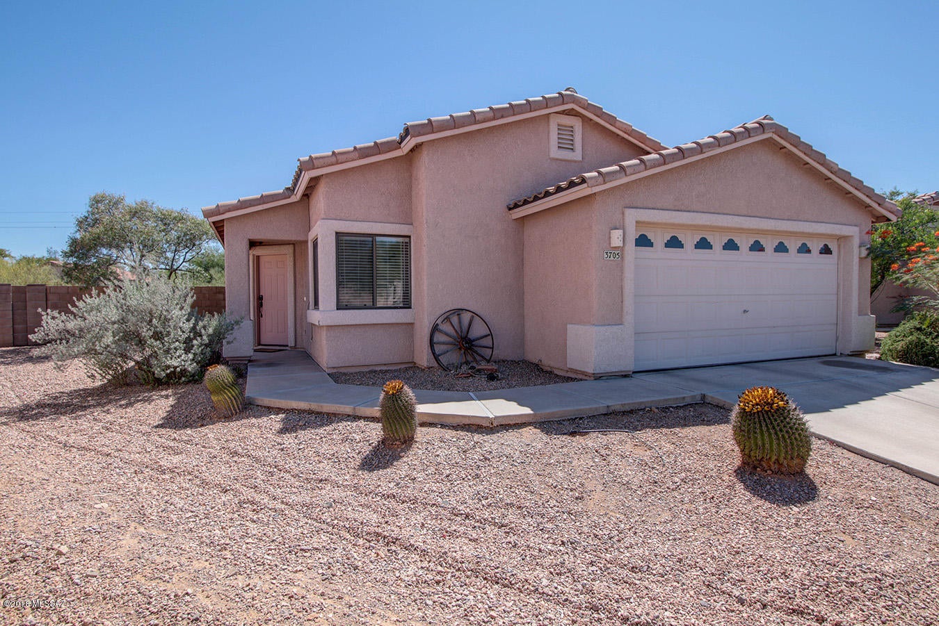 Absolutely stunning 4BD/2B home on over 1/4 acre lot at the end of the cul-de-sac in a gated community.  Has a large private backyard that includes 1200 sq. ft. of flagstone patio,chiminea, built in gas/charcoal BBQ. Enjoy mountain views, pristine natural desert, privacy, and a perfect place for outdoor entertaining.  Loads of features including 20 inch Italian tile throughout, Mexican tile kitchen counters, flagstone in master bath, split bedroom floor plan, extended garage, gas/wood fireplace, Solar Paid For By Owner, and much more!! Only one block away from the refreshing community pool, playground and community trail.  Call to schedule a showing for this amazing gem today!  Available June 1st.