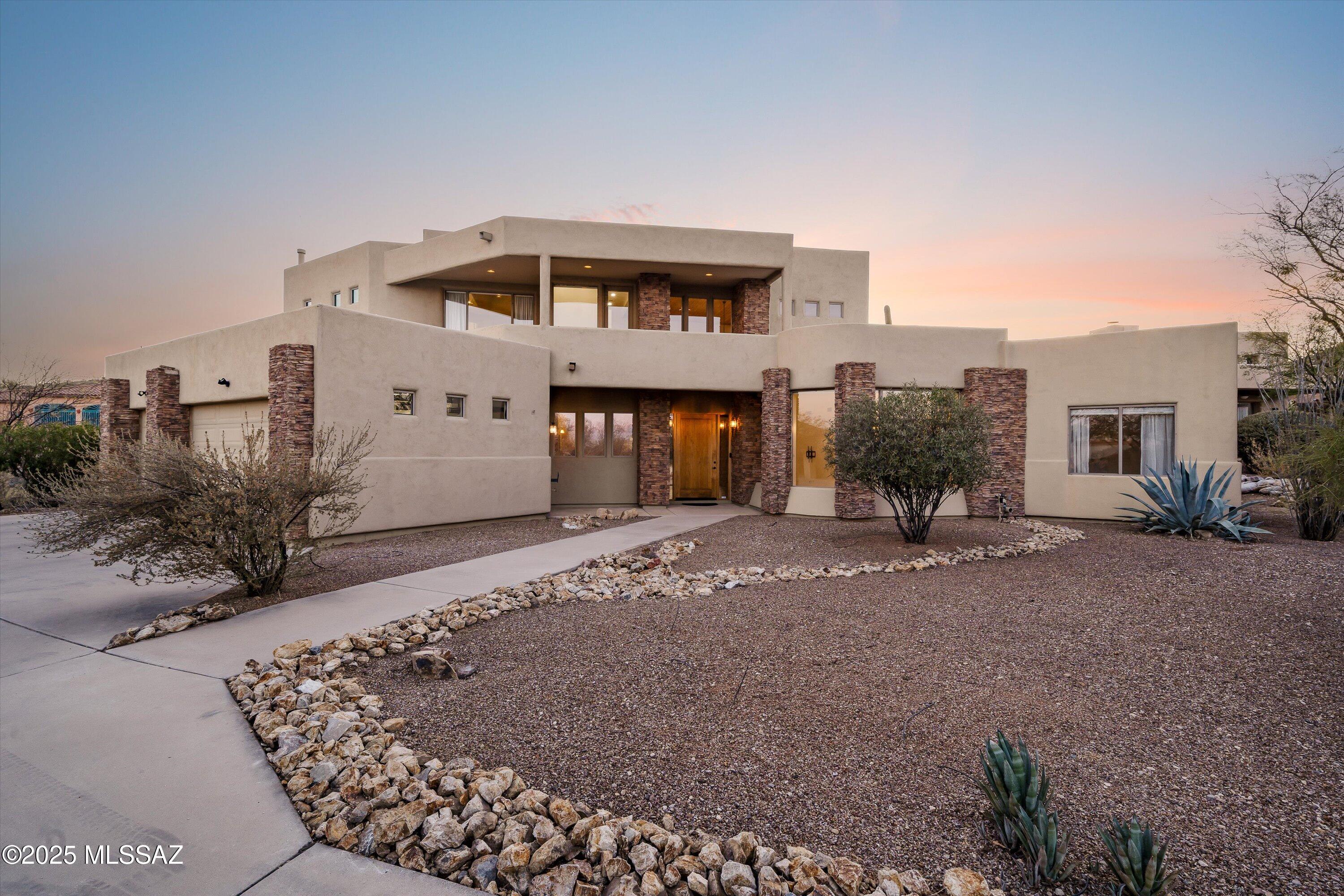 Come experience all the beauty and convenience of Tucson's west side with this two story, 3 bedroom, 3 bath cul de sac property located in Starr Pass. Perfect for entertaining, the living space features soaring 22' ceilings along with a spacious kitchen with ample storage. The loft area has a built in library with office cabinets and access to two balconies just made for stargazing or watching the sun set. Outdoor living space features a freshly replastered heated pool and spa, as well as a gas fireplace and new built in bbq. The roof has just been recoated and the HVAC systems are newer.  This tranquil property features quick and easy access to I-10, Mercado San Augustine, Fox Theater, and downtown dining and entertainment, as well as Tumamoc, Gates Pass and Tucson Mountain Park.