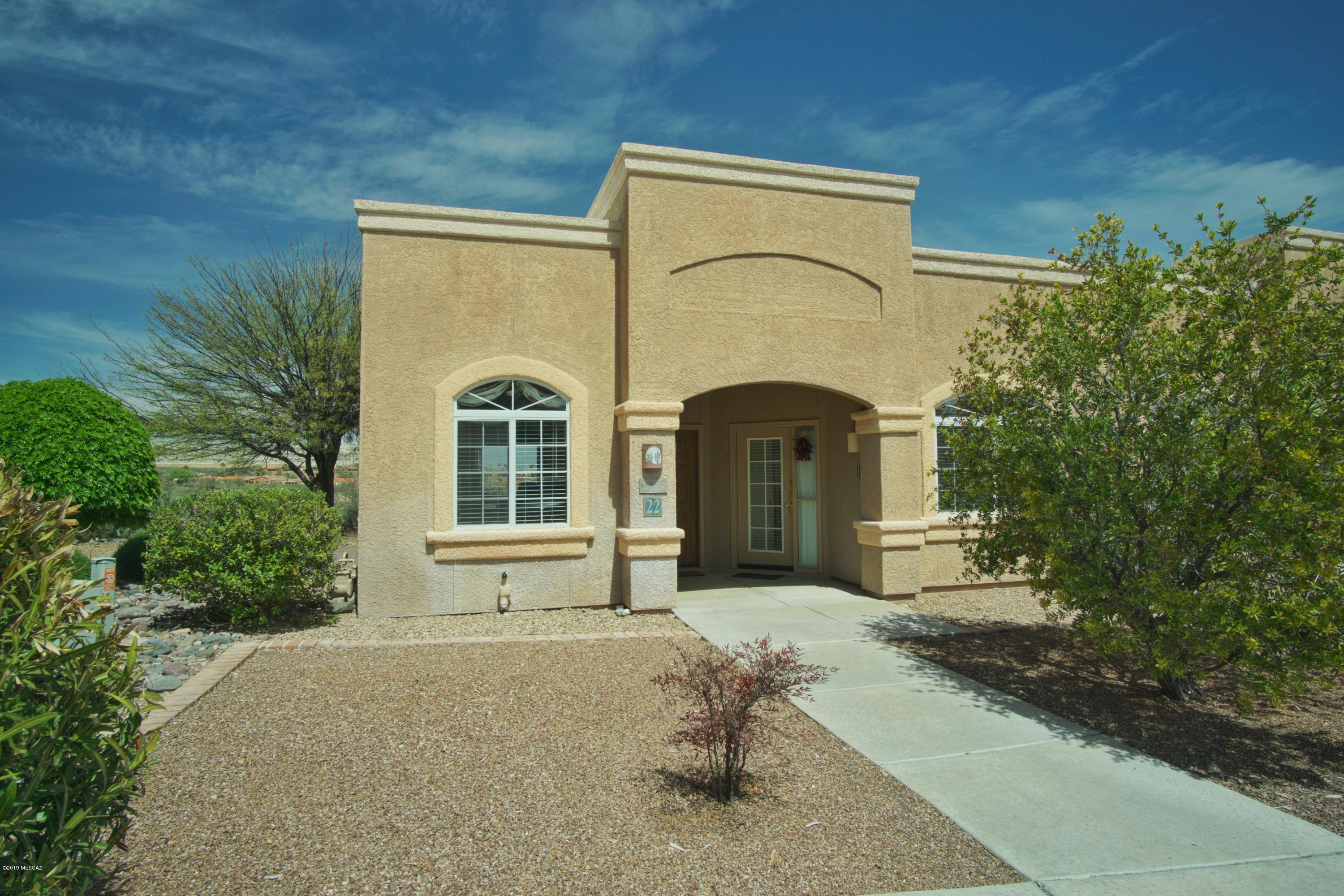 Fully furnished 1356 SF Townhouse has 2 Master Suites with one having a lock-out/separate entrance for guests or to use as a rental.Elevated lot above San Ignacio Golf Course with Catalina Mountain and City Views. Patio overlooks arroyo to enjoy the wildlife and natural desert beauty. This well maintained Townhouse is great for year round living, a winter retreat or as an investment.