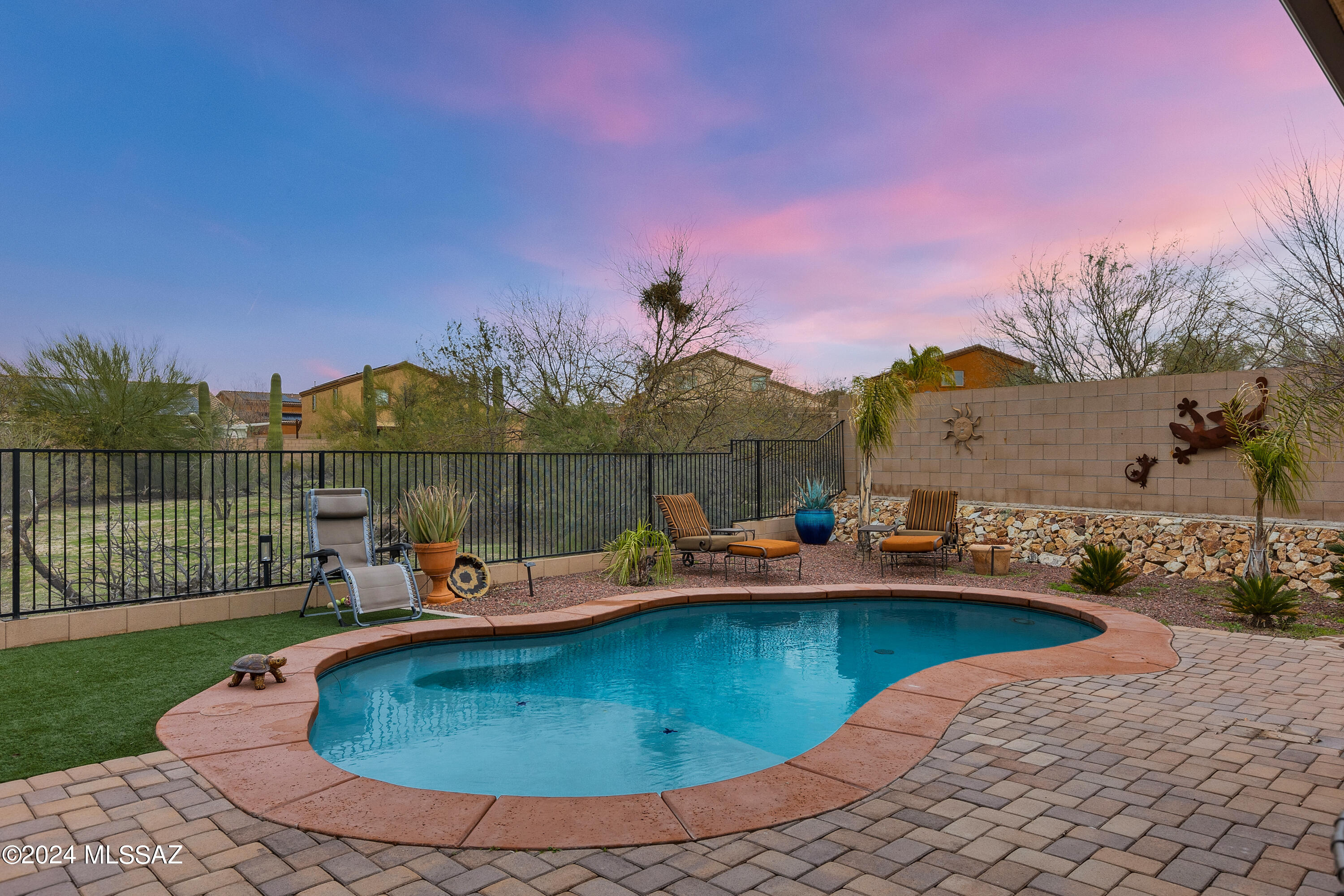 Welcome to this beautiful, must see single story with 3 bedrooms, 2 baths, a den, a 3-car garage, and 2696 of living space situated on a cul-de-sac. This charm has upgrades throughout the house to include beautiful quartz kitchen counter tops with a backsplash, tile throughout the house, and tiled wall showers. Of course, you can't forget about the resort like backyard that includes a pool with a paver pool deck, artificial turf, and an oversized ramada to enjoy your family get-togethers. The beautiful features are endless.  Come see this beauty and make it yours!