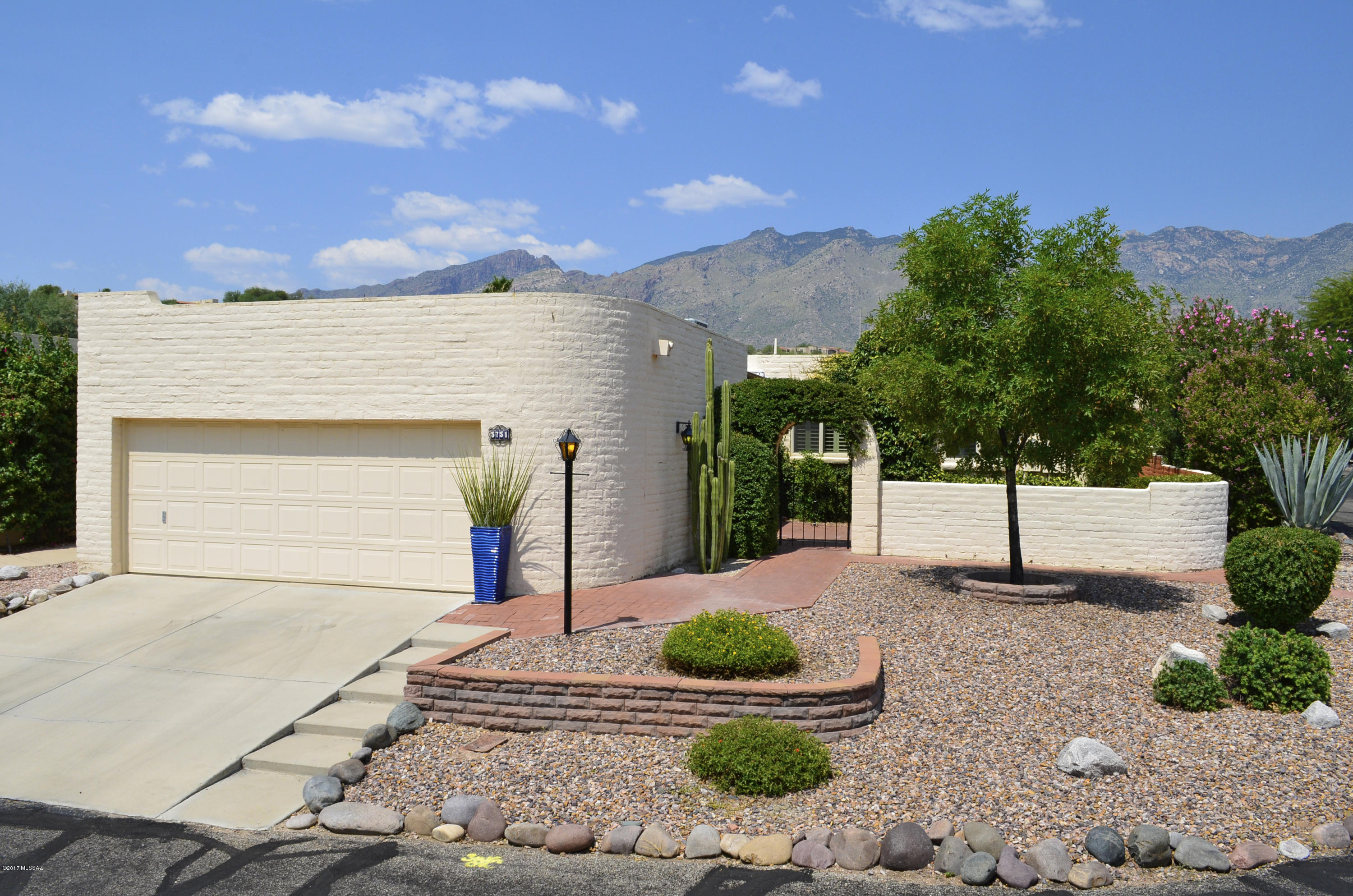 Stunning Fairfield Home on a Private Corner Lot with Catalina Mountain Views. Bright Kitchen with Alder Cabinets, Corian Counters, Undermount Sink & Glass Cooktop. Sunny Breakfast Nook with Plantation Shutters. Huge Open Great Room with Wide Plank Flooring. Dining Area for Entertaining. Spacious Master Suite with Walk-in Closet with Built-ins. Master Bath with Large Shower. Generous Guest Room & Full Guest Bath. Large Laundry Room with Cabinets & Pantry Area. Canister Lighting & Upgraded Lights Fixtures, Gorgeous Flooring & Ceiling Fans Throughout. Oversized 2-Car Garage with Cabinets. Fabulous Outdoor Living Space with Two Shady Covered Patios, Extended Brick Paver Patio & Meticulous Landscaping. Welcoming Courtyard with Arched Entry. Catalina Foothills Dist 16 Schools. Move-in Ready.