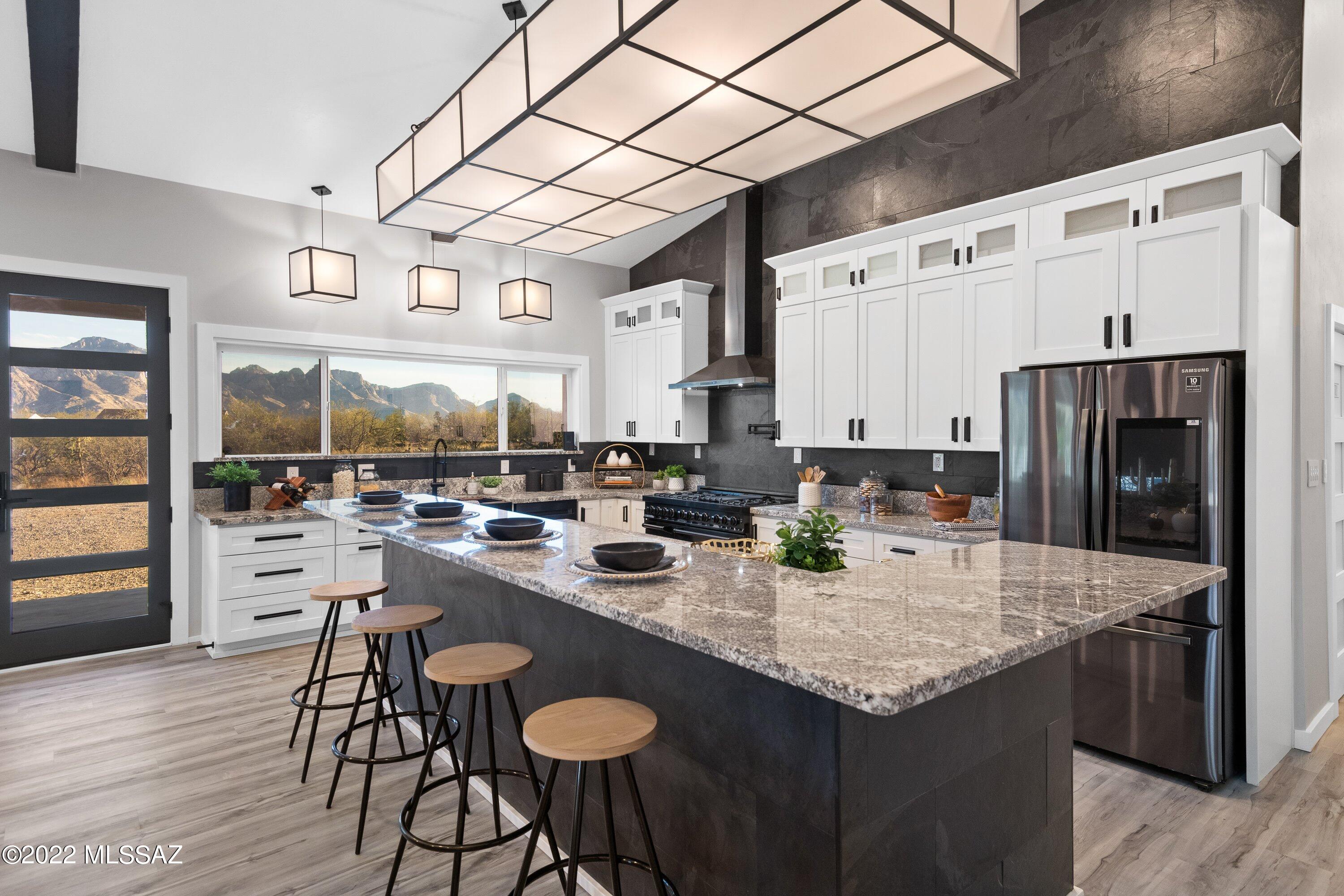 RARE CUSTOM NEW CONSTRUCTION?  You got it!  Gorgeous mountain views from your expansive 100ft+ patio?  Yes please!  Outdoor living at its finest w/ full RV hookups and room for toys in the 4-car garage?  Yep, & no HOA!  Luxurious primary suite with dual shower heads, free standing tub, cozy fireplace, dual vanities, & grand walk-in closet w/ island?  It's here!  Have culinary skills?  Highly upgraded gourmet kitchen w/ massive island, 48'' range, 2 ovens, drawer microwave, fridge, dishwasher, wine fridge, and HUGE pantry!  Seriously, you've got to see the pantry!  Guests? Large in-law suite plus Jack/Jill bedrooms. Enjoy the glow of the fireplace from indoors OR outdoors or hit up nearby parks/trails!  Smart home tech too!  Front lot available for extra privacy 150k.