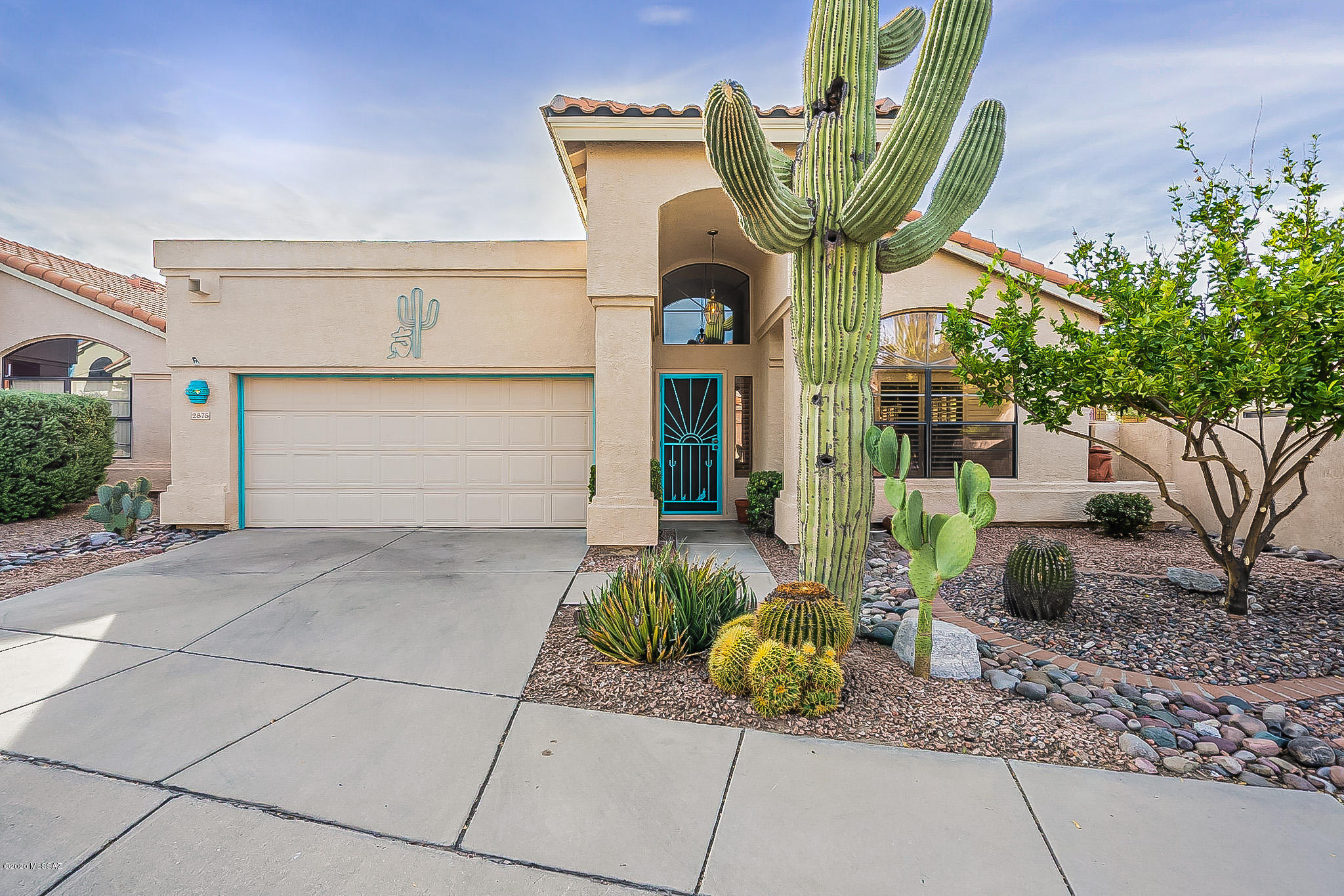 Fantastic home located in the quiet, secluded Enclave with back yard gate access to the River Walk: walking/biking trail. Designer colors through out emphasizing the architectural features.  Eat in Kitchen with Island and breakfast bar seating. The kitchen has  granite tile counters, travertine back splash and stainless appliances. The spa like master bath has travertine counters, stone sink and gorgeous shower. Light travertine stone flooring and plantation shutters add to the elegance of this home. Premium, private lot with no homes behind. Lovely, low care yard with sunset views and covered patios make this home ideal for entertaining or relaxing.  So close to everything but feels away from it all!