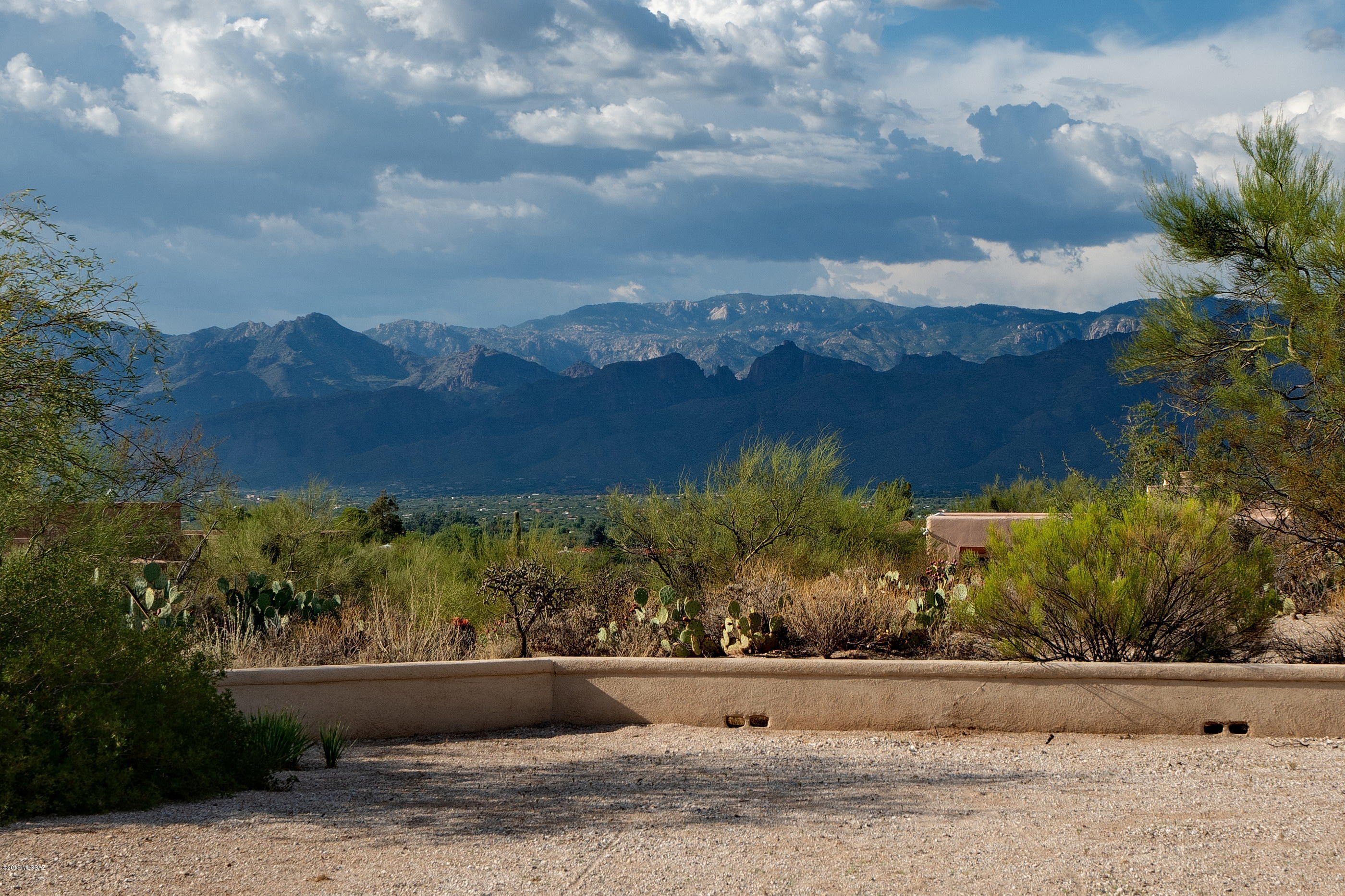 Beautiful Southwestern style home in a small neighborhood on an oversized, mountain view lot. Built in 2002, this home is freshly painted inside and out, new roof, and in impeccable condition. As you enter, the foyer and great room will give you the feeling of spaciousness and grandeur. The sweeping unobstructed mountain views will take your breath away. Close to shopping & entertainment, but feels like country living.
