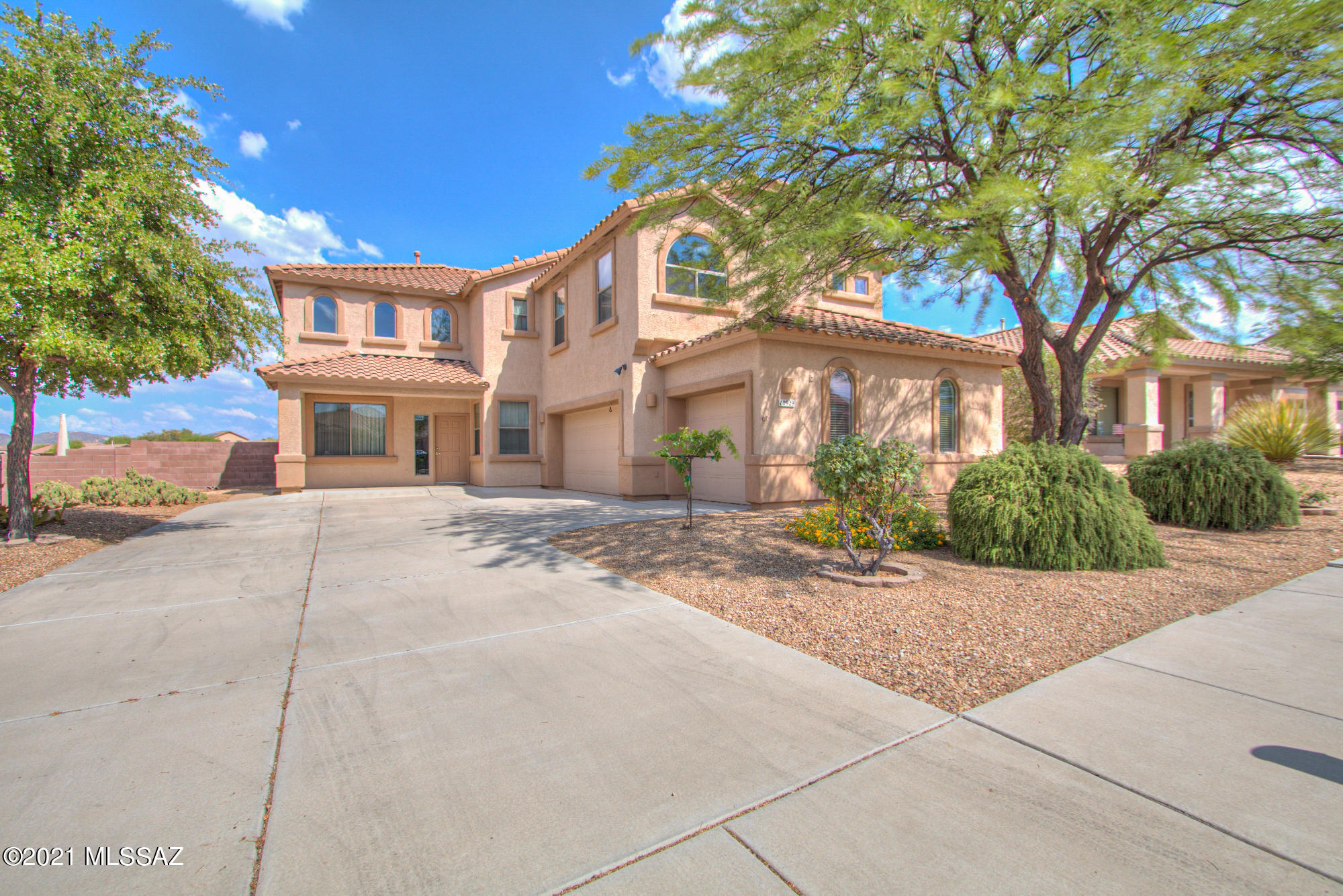 Oh the views!  This is a beautiful 4bed / 2(1/2)bath  home with a wonderful open layout.  There have been many new and upgraded features virtually everywhere in this stunning home.  New carpeting throughout, new luxury vinyl plank kitchen flooring, new and upgraded kitchen appliances, custom Cherrywood shelving in the master bedroom walk-in closet, custom built in 875-bottle wine cellar with its own cooling system, upgraded wrought-iron bannister, and designer paint job throughout.  The open layout of the kitchen offers its own dine-in area.  Other rooms are: a formal dining room, living room, spacious family room with a wood burning fireplace, office, and a generous loft area.  It's also located within walking distance to Cienega High School. The east facing large backyard is the perfect oasis to enjoy unimpeded views of the Rincon Mountains, and to entertain after a long hot day to take in spectacular sunsets.   Don't miss it!