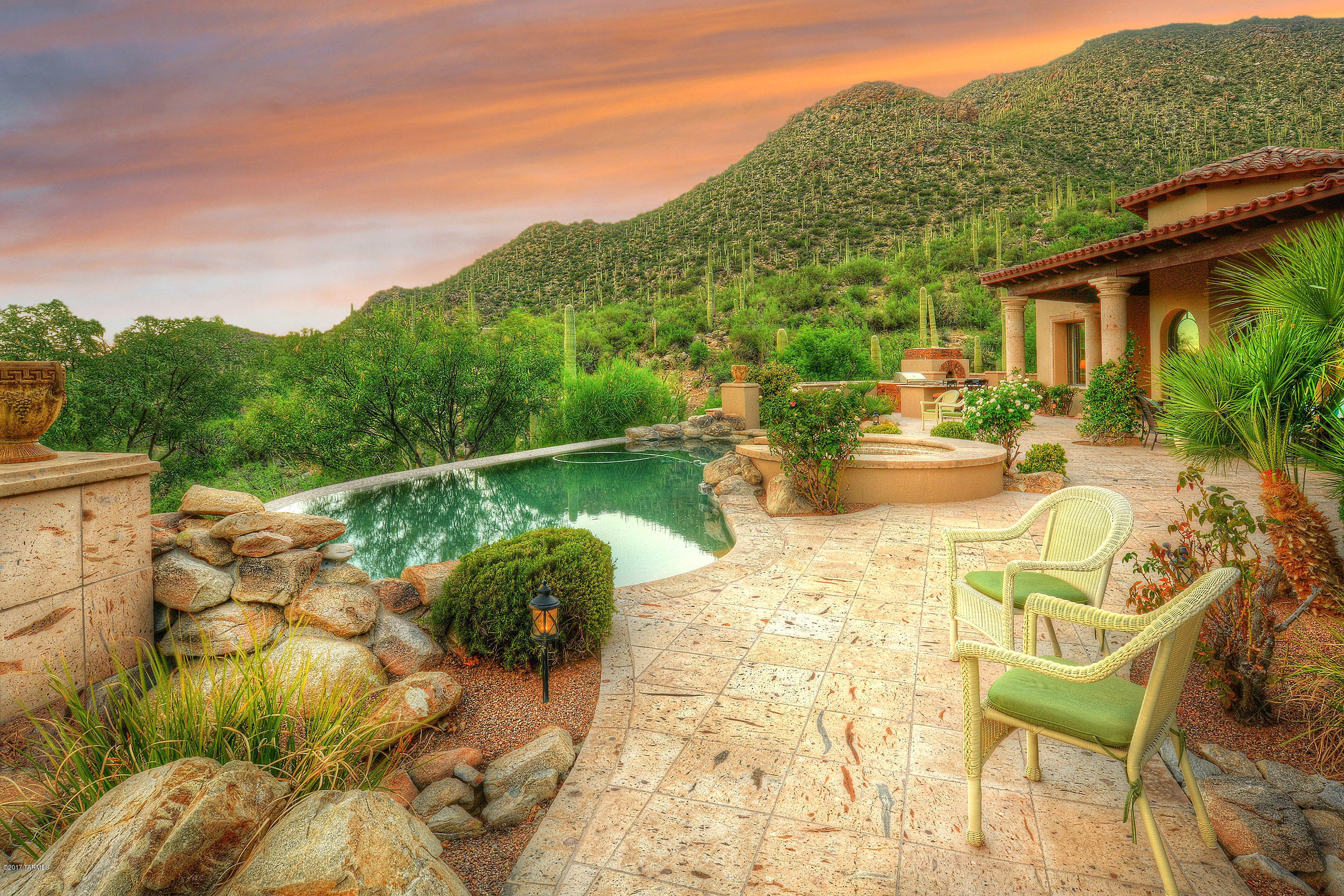 *MAJESTIC MEDITERRANEAN* STUNNING ARCHITECTURE BLENDED W/ITALIAN INFLUENCE CREATE THIS EXQUISITE MASTERPIECE!NESTLED AMIST SOARING SAGUAROS/ROCK OUTCROPPING & MONUMENTAL MTN/VALLEY VISTAS!QUALITY MASONRY CONST,ALAN ROBERTS DESIGN/LORI CARROLL INTERIORS REFLECT ELEGANCE & RICHNESS!PERCHED ON 1.49 ACRE HOMESITE OFFERS EXPANSIVE VIEWS IN EVERY DIRECTION!ENTER PRIV ''GATED'' MOTOR COURT TO WELCOMING COURYARD...FEELS LIKE YOU STEPPED INTO THE ITALIAN COUNTRYSIDE!IMPRESSIVE HANDCRAFTED 12FT METAL DRS OPEN TO THE GRANDEUR ''GATHERING ROOM'' HIGHLIGHTED BY ARRAY OF ARCHED WINDOWS,SOARING FP & FOREVER VIEWS!CANTERA VERANDA'S EMBRACE THIS ENTIRE ESTATE CREATING A RESORT FEEL~ SPARKLING POOL/SPA/FULL OUTDOOR KIT/PIZZA OVEN & FIREPIT TO ENJOY AZ OUTDOOR LIVING & ENTERTAINING!LUXURY UPGRADES GALORE... INTERESTING ARCHITECTURE- INCLUDES FLORENTINE CEILING TECHNIQUES, CANTERA STONE ELEMENTS & ACCENTS, SOLID WOOD FLOORING, TRAVERTINE/LIMESTONE/QUARTZ NATURAL STONE FLOORING-SHOWERS, WOOD FRAMED QUALITY WINDOWS & DOORS THRU OUT, 1000 BOTTLE WINE CELLAR ROOM, ! ENJOY COOKING IN THIS AMAZING KITCHEN- ABBUNDANCE OF CABINETRY, GENEROUS AMOUNT OF COUNTER/PREP AREAS, FULL VIKING PROFESSIONAL APPLIC SERIES, BUTLERS PANTRY AREA- PREP SINK AND EXTRA OVEN FOR PARTY/HOLIDAY PREPARATION. GRAND "FORMAL DINING" LOCATED IN THE HUB OF THIS HOME...BORDERS KITCHEN AND GREAT ROOM- FEATURES A EXPANSIVE BUFFET INCLUDES WET BAR, 2 WINE REFI -PERFECT FOR RED/WHITE  WINE, GLASS DISPLAY CABS & UNIQUE TILE BACKSPLASH! MASTER RETREAT SHOWCASES A DIGNIFIED & TASTEFUL SUITE- BOASTS SEVERAL VANITIES & MAKEUP AREA, DUAL WALK IN STEAM SHOWER- RAINFOREST HEAD, SPACIOUS HIS/HER SEPERATE CLOSETS, WONDERFUL SPA TUB! SPLIT BR PLAN- OFFERS SECOND MASTER SUITE! HUGE BEDROOM ENSUITE CAN ALSO BE CONVERTED TO MEDIA ROOM ( CONTAINS ALL THE WIRING/HUB FOR COMPONENTS) BEAUTFUL BEDROOM WITH COFFEE STATION/BAR, SPA TUB/STEAM SHOWER- QUARTZ TILE/ACCENTS...YOUR GUESTS WILL FEEL LIKE THEY ARE IN 5 STAR* RESORT-EVEN HAS ITS OWN PRIVATE PATIO! SECONDARY GUEST ROOM IS ALSO AN ENSUITE WITH WALK IN SHOWER, PRIV VIEWING PATIO! 4TH BEDROOM- SHOWING AS WONDERFUL OFFICE/DEN- COULD ALSO BE NURSERY SINCE CLOSE TO MASTER RETREAT! PLENTY OF STORAGE SPACE- OVERSIZED 3 CAR GARAGE WITH SEPERATE STORAGE ROOM/ WORKSHOP & UTILITY SINK. THE LIST GOES ON AND ON... POPULAR VACATION LOCATION- DOVE MTN OFFERS AWARD WINNING 5 STAR* RITZ CARLTON RESORT/DOVE MTN GOLF CLUB, GALLERY FITNESS/GOLF COUNTRY CLUB, TONS OF HIKING/BIKING PATHS, EXCELLENT RESTURANTS, SHOPPING AND SOME OF THE MOST BEAUTIFUL VIEWS & MTN RANGES IN ALL OF ARIZONA! COME ENJOY...MAKE THIS YOUR NEW HOME!