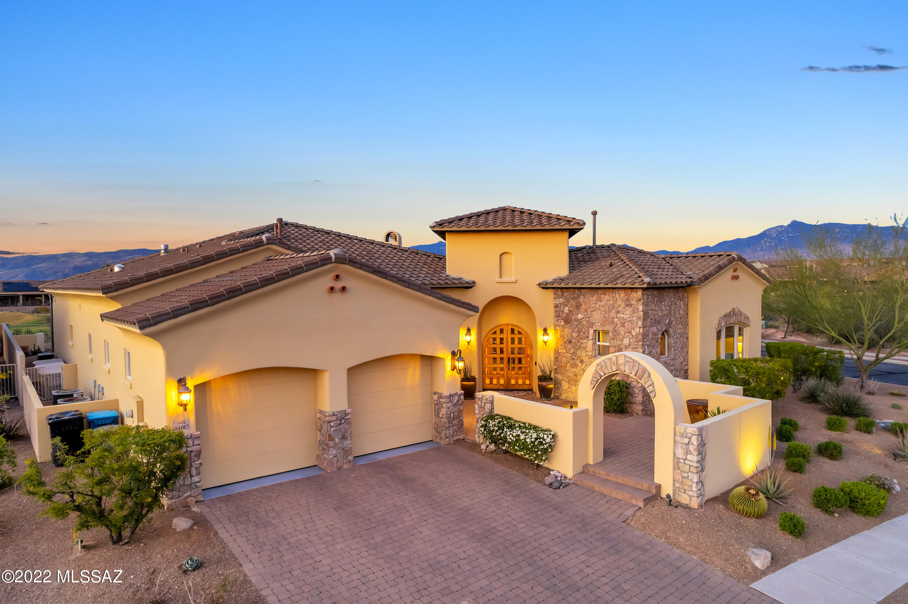 Stunning GEM in Gated Wingview on Rancho Del Lago Golf Course** This Former Model for local Custom Builder is built w/METAL Framing & MASONRY BLOCK construction! Then, lavished w/fine finishes of Travertine floors, Granite & Quartz counters, Maple & Alder Cabinetry, Slate accents, 8' Alder Doors & 12' Ceilings throughout, Surround Sound all crowned with Tuscan Styling.  Wow!! On nearly 1/4acre on an elevated lot above the 7th Home of Del Lago Golf Course, the setting is also idyllic w/panoramic views of the Rincon Mtns. If you like storage, it is hard to imagine a home w/more of it than here. The extnd length & extra height 2.5 car garage is immaculate w/new expoxied floor. So tranquil in either of the 2 courtyards or on rear cov'd patio. BRAND NEW ROOF Nov 2021!! And there is more. Wonderful outdoor living is readily accessible from many rooms. The front courtyard is charming and inviting.  The mid-courtyard is private and ambient w/fireplace and fountain. The rear yard has an easy care Spool, elevated deck, private space off guest bedroom & Built-In BBQ. This is it!  Quintessential AZ living:)