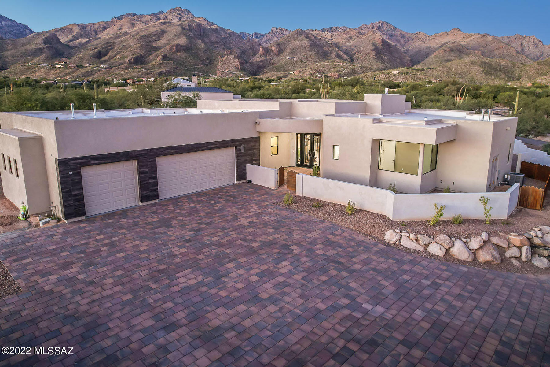 Sophisticated new southwest contemporary designed by Greg Simmons & crafted by Al LeCocq. The private 2 acre lot is within walking distance to Sabino Canyon, schools and offers stunning mountain views! Magnificent home for discerning buyers who truly understand quality in workmanship. Spacious open, and bright great room floor plan w/soaring ceilings, floor to ceiling windows, 8' solid doors and gorgeous tile throughout. Gourmet island kitchen has beautiful high end cabinetry by Affinity Kitchens, top of the line SS appliances, built-in refrigerator, Quartz counters and large walk-in pantry. Spacious primary suite and 4 luxurious bathrooms. Enjoy the great outdoors in the large north east facing rear yard with the expansive covered patios, built-in BBQ and stunning views! See more section Rear yard will be fully enclosed. Builder waiting to see exactly how buyers want it enclosed. See Pool and Landscape drawing option in attached documents. 

Please see amazing 3D scan, video, floor plan and all photos.
Esperero Wash crosses over the west end of the lot. See photo section for photo of wash running after a summer monsoon.

Please use Agave Title, Kelly Ladrido Escrow Officer. 520-918-1683. Kellyl@agavetitle.com. Early bird prelim has been received.

Al LeCocq was SAHBA's Custom Home Builder of the Year award winner 2 times. LeCocq Custom Homes are built with engineered post tension slabs, fully sheathed plywood exterior walls, R-38 insulation in the ceilings, Low E windows and many other custom features.

There are 2 access gates. The 2nd gate (which is currently open) is for the 3 new luxury home community being built by LeCocq. There is no HOA however there are recorded gate and road maintenance agreements that currently total approx. $122 per month. There will be additional fees required for the LeCocq community shared road and gate maintenance.