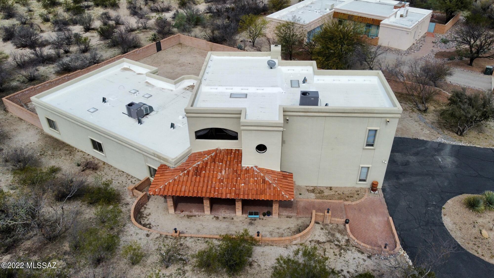 OPEN HOUSE HAS BEEN CANCELLED FOR 3/25/22. Your dream Southwestern style Arizona Ranch home has come to market with Panoramic Mountain Views of both the Catalina and Rincon Mountains offering 5 bedrooms, 3 bathrooms, Great room with 20 foot tall wood beamed ceilings with clerestory windows for natural light & 5 skylights. Large windows in all the right places bring the mountain views with privacy right into the home. 2 balconies for star gazing & viewing the nature the Sonoran desert has to offer. Oversized 2 car garage w/ separate storage area. Rain cisterns gather water for the garden & fruit trees. There is a  tranquil nature path lit w/ solar lights on the West side of the 1.17 acre property. HOA is only $2 per month!  Formal Dining room has new Saltillo tile & lighting for the Southwestern feel. Spanish tile kitchen backsplash and in the showers.