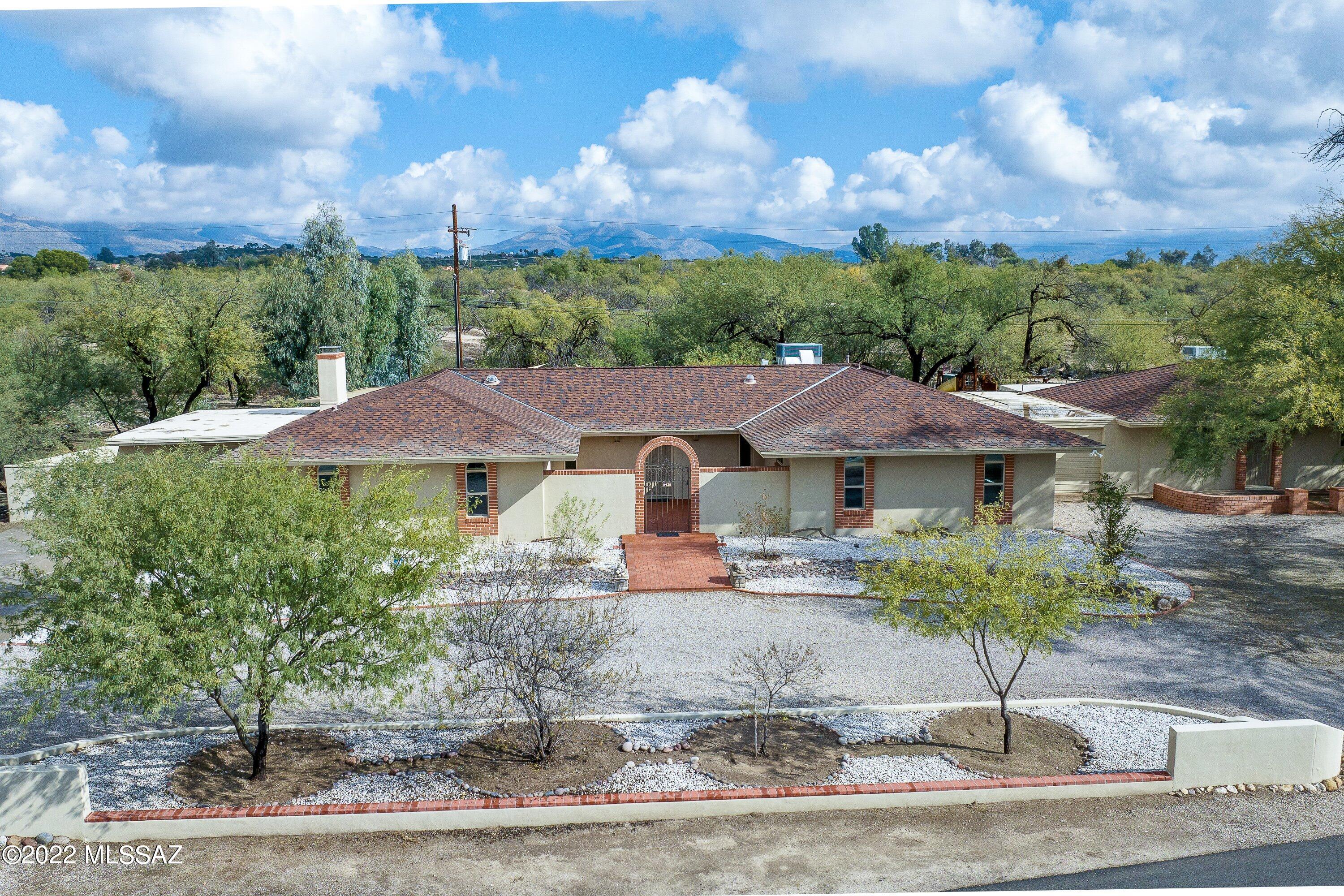 This property is on almost an acre in a secluded neighborhood on the northeast side, minutes away from shopping and amenities. Main house has been renovated throughout in 2020. Mesquite trees give the property a park-like feel. close to hiking in Sabino Canyon and 10 miles to downtown Tucson. Pool for great summer fun. Shared water well (3 homes) but also offers hookup to city water. The large guest house with 3 rooms is perfect for parents, guests or family which allows for proximity and privacy. Horses welcome and no HOA! Owners pay approximately $1200 a year for flood insurance