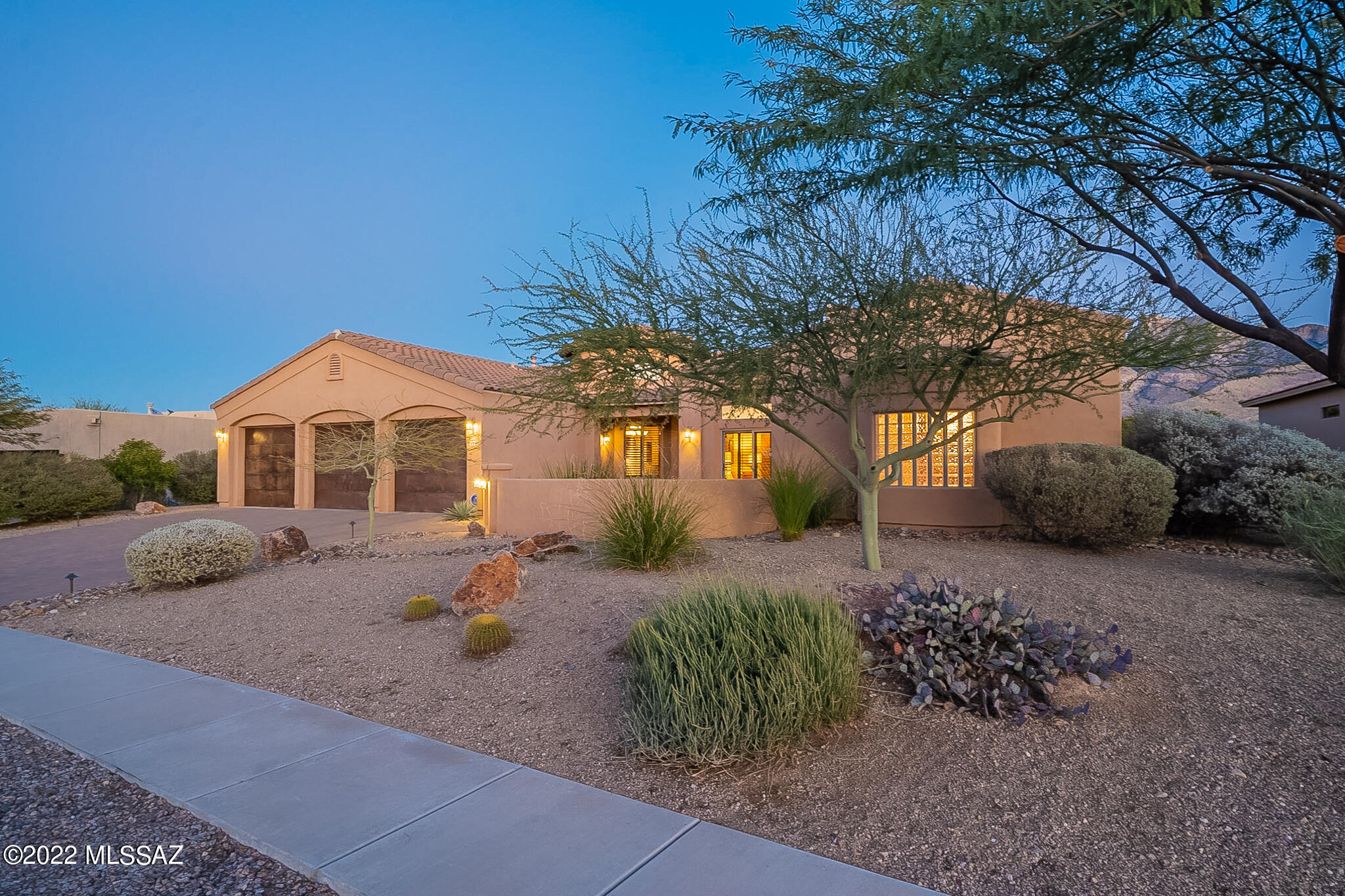 Amazingly rare opportunity to purchase a move in ready, minimally used Corporate Retreat and former
model home. You will enjoy privacy and unparalleled views of the Catalina Mountains and Pusch Ridge
from the premium situated lot along with an intimate brick paver front courtyard with separate
entrance into office/den area. Home features: Large great room with fireplace,gourmet eat-in kitchen
with granite counters and stainless steel GE Profile appliances. The formal dining room is sure to impress with its circular wood cathedral ceiling. Split floorplan with grand master suite, his/hers vanities and closets with an oversized walk in shower and garden tub. Ceramic tiled floors with carpeted bedrooms, central vac, zoned dual HVAC,alarm system and private sparkling pool. Sellers will negotiate inclusion of all interior contents and outdoor furnishings with acceptable offer OR all contents may be purchased on a separate bill of sale.