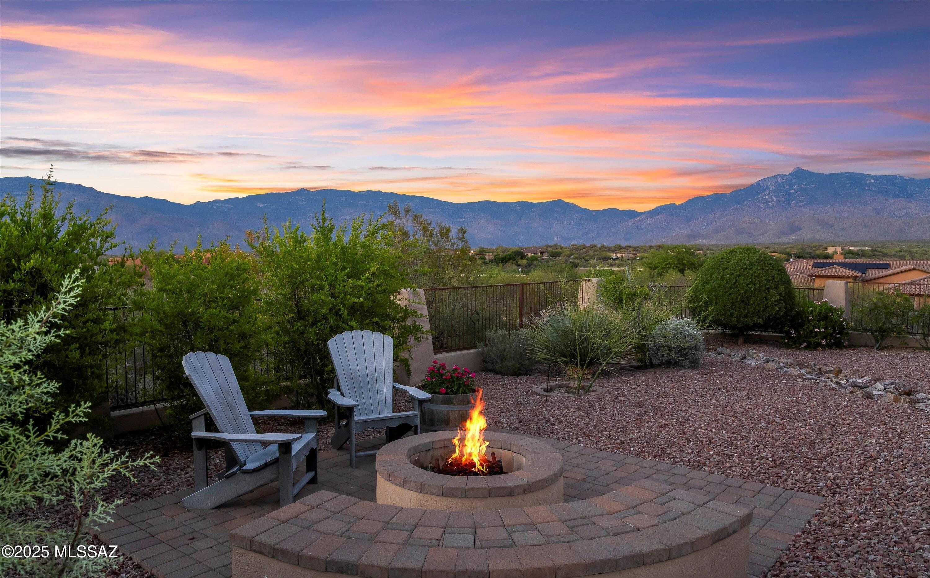 Experience wide-open living under the endless skies of Vail, Arizona.
Situated on 1.68 acres of pure desert serenity, this 4-bedroom, 3 bath retreat invites you to embrace a slower pace of life, where the Rincon Mountains rise in the distance, and every sunrise feels like a personal show. Mornings begin with coffee on the wrap-around porch, birdsong in the air and soft golden light spilling over the landscape. Evenings are reserved for stargazing in quiet stillness, far from city lights. Step inside to an airy, open-concept layout bathed in natural light. Solid wood doors, rich cabinetry, and skylights create a warm, grounded atmosphere. The granite-clad kitchen and stainless-steel appliances open seamlessly to living and dining areas designed for effortless connection, whether it's a weekend brunch or a holiday gathering. Retreat to spa-inspired bathrooms with oversized soaking tubs and walk-in showers, while two flexible bonus rooms offer the freedom to create -hgym, art studio, or peaceful workspace. The finished 3-car garage provides both practicality and storage. With recent updates including a new roof (2022), dual A/Cs, and gas water heater (2025),  the home is as dependable as it is beautiful. Located in a quiet enclave where neighbors wave and the desert stretches endlessly, this is more than a home, it's the Vail lifestyle: spacious, scenic, and effortlessly peaceful, all just minutes from top-rated schools and everyday conveniences.