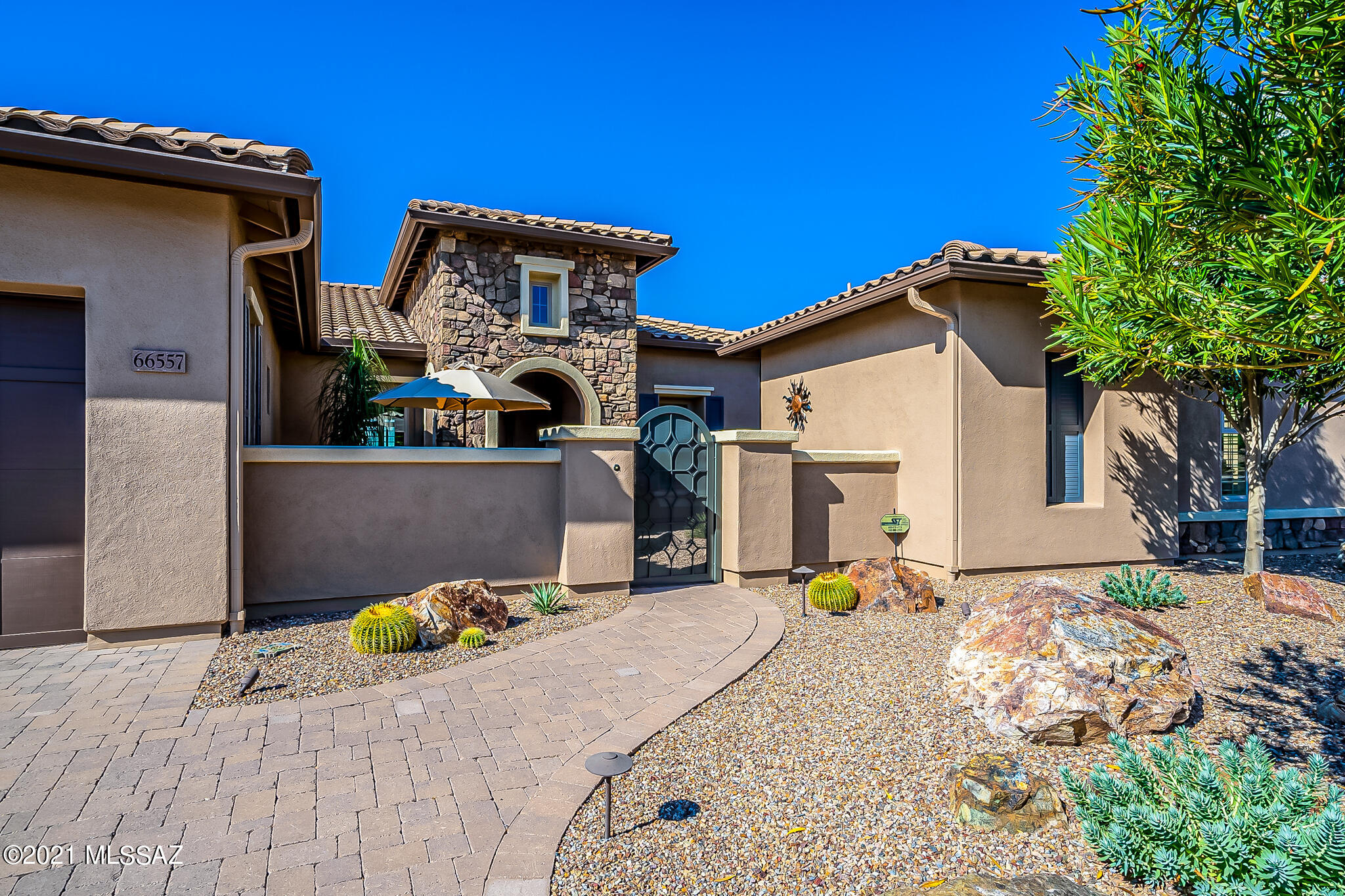 Ultimate in luxury living. Located above the 10th fairway of The Preserve Golf Course including beautiful views of the Catalina Mts.
Save on energy costs with 2019 installed, fully owned 9.1 KW Solar Power System with Tesla Powerwall battery and plug to charge any electric vehicle. Tierra floor plan features all en-suite bedrooms plus a large casita. Soft contemporary interior is open and bright.  Master retreat with luxury bath and adjacent den/study with custom built-ins. Resort backyard features a waterfall & pond, fire pit, deep covered patio with auto screens and a 2019 pebble tech, heated pool with water feature.  Pelican whole house water filter/softener. Yard is fully fenced w/gates. 2 solar tubes. 4 wifi remote controlled thermostats. LG W/D new 2019
Exterior painted 3/2021 Central vacuum system
Security system
Surround sound with speakers in great room and den