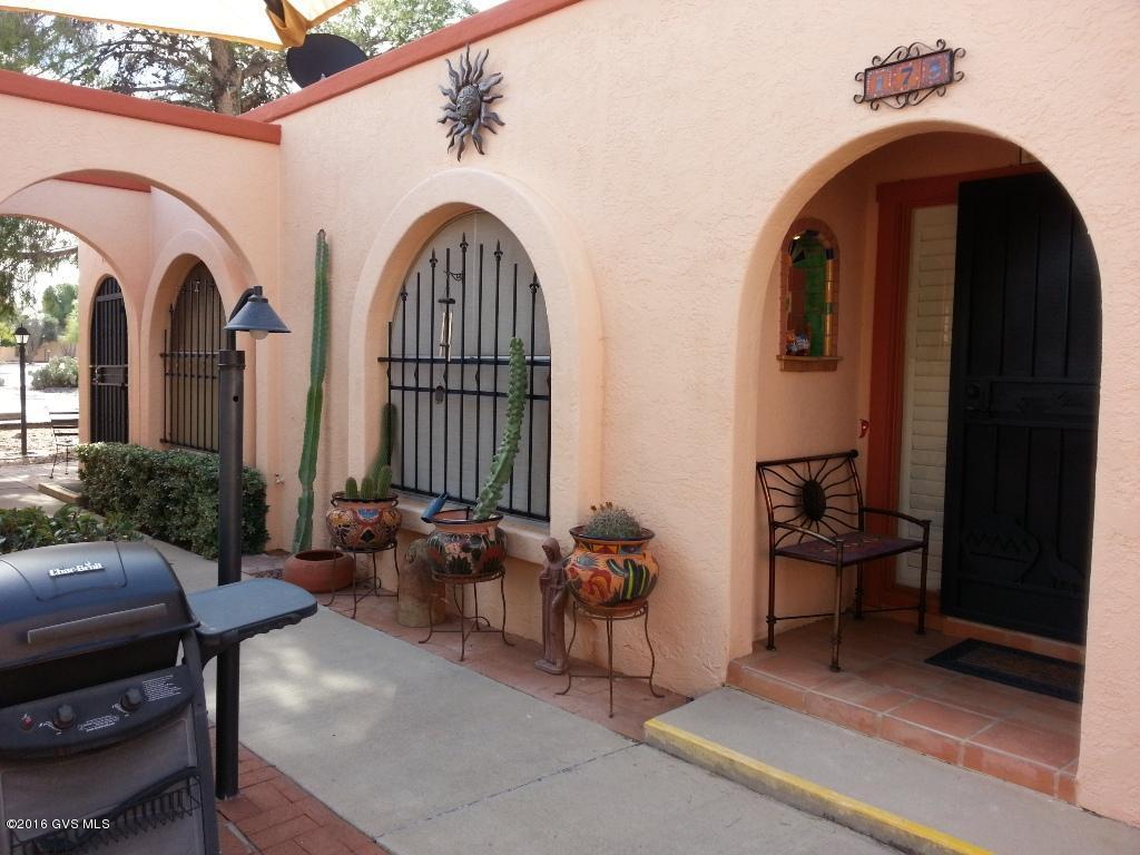 Colorful SW ambiance! Totally updated: tile floors, kit sink, faucet, DW, drop-in stove, new frige, tile countertops & backsplash, undercab lights, light & plumbing fixtures, W/I shower, full size washer/dryer & heating/cooling. Comes completely furnished including dishes, linens and decorative items, TV, the works as you see it. Bring your toothbrush and enjoy the Arizona sunshine! Morning sun dances in the kitchen through plantation shutters covering a pretty arched window overlooking Courtyard C touting large shade trees. Perfect location less then 200 feet to the private Green Valley Resort Home's pool & spa. Tennis & GVR West Center is across the street. Continental Plaza down the street. Rented J/F/M 2018. Buyer must honor lease.