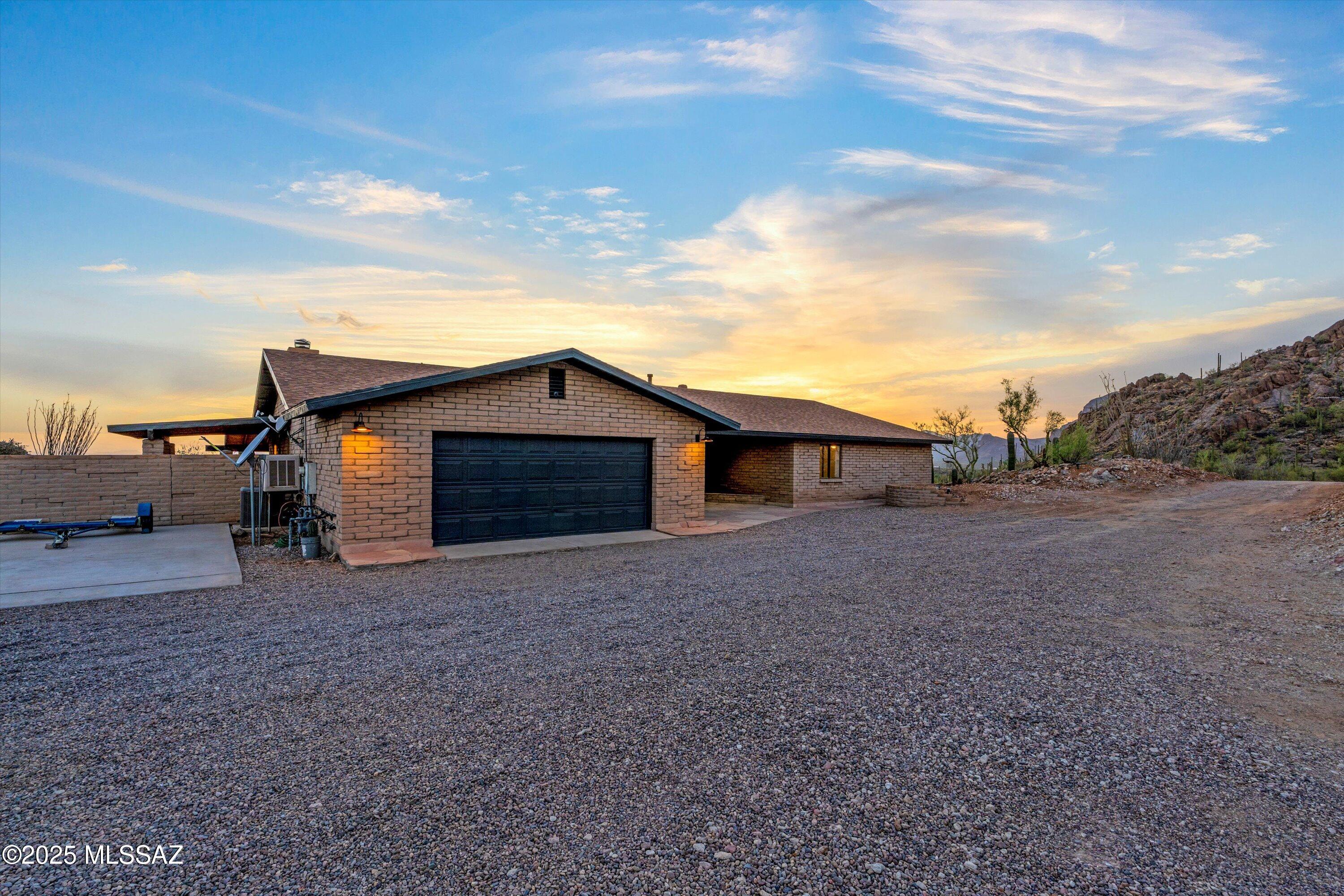 Set upon nearly 3.3 acres of natural desert landscape, this remarkable property offers breathtaking mountain views that greet you at sunrise and bid you farewell at sunset. The energy here is grounded, vibrant, and ready to support its next owner in a life of balance, beauty, and possibility.

Inside, the fully updated home welcomes you with four spacious bedrooms and two beautifully remodeled bathrooms. A brand-new kitchen complete with quartz countertops and modern appliances invites both everyday ease and joyful gatherings. The home is thoughtfully enhanced with smart home integration, central vacuum system, and a whole-house water softening system. Every detail has been carefully refreshed  from new lighting and fixtures, 220v pre-wire in the garage for an EV, to the upgraded HVAC and a brand-new roof under warranty  allowing you to step into effortless living from the moment you arrive.

Step outside and experience the property's true soul: a sparkling pool and spa surrounded by peaceful desert vistas, offering daily renewal under the wide Arizona sky. The additional pool house presents endless opportunity  whether as a future guest house, creative studio, or private retreat.

This is more than a home  it is a sacred space for inspired living, where nature, privacy, and possibility come together in perfect harmony.