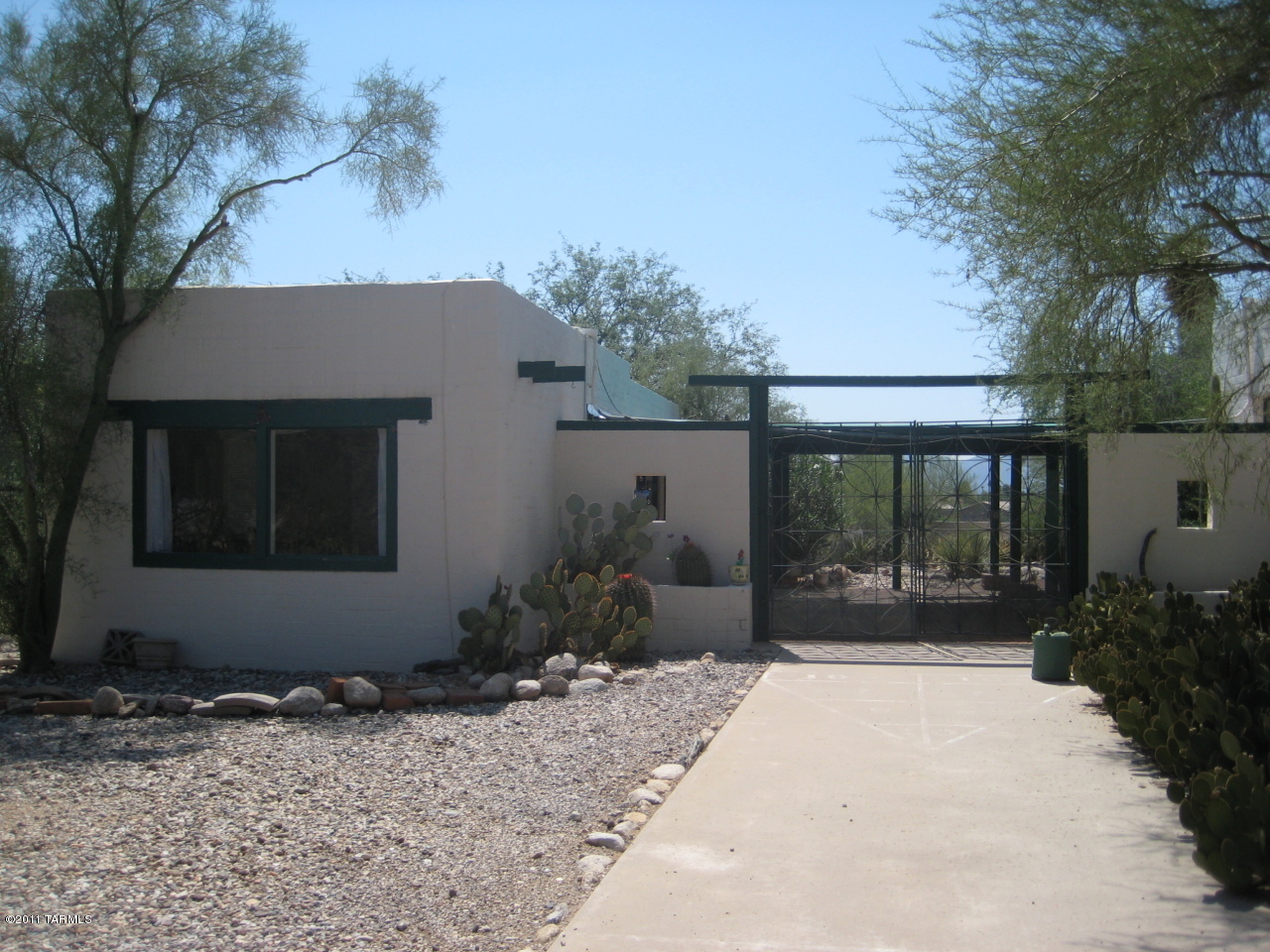 GUESTHOUSE - fully furnished with private entry in a beautiful and natural environment, special and charming on 2.5 acres, separate and cheerful large kitchen/dining area, spacious great room/bedroom studio plan with picture window. Your GUESTHOUSE is complete with all furnishings including dishes and has a tasteful style from suede dining chairs and accent lighting to a matching highrise headboard and a couple unique pieces. Sparkling pool shared with main house. Mountain views, a colorful sunset, and amazing nature, yet close to everything. -Fabulous lease with all utilities including wifi, basic cable, and shared w/d room. This guest house is an enjoyable place!