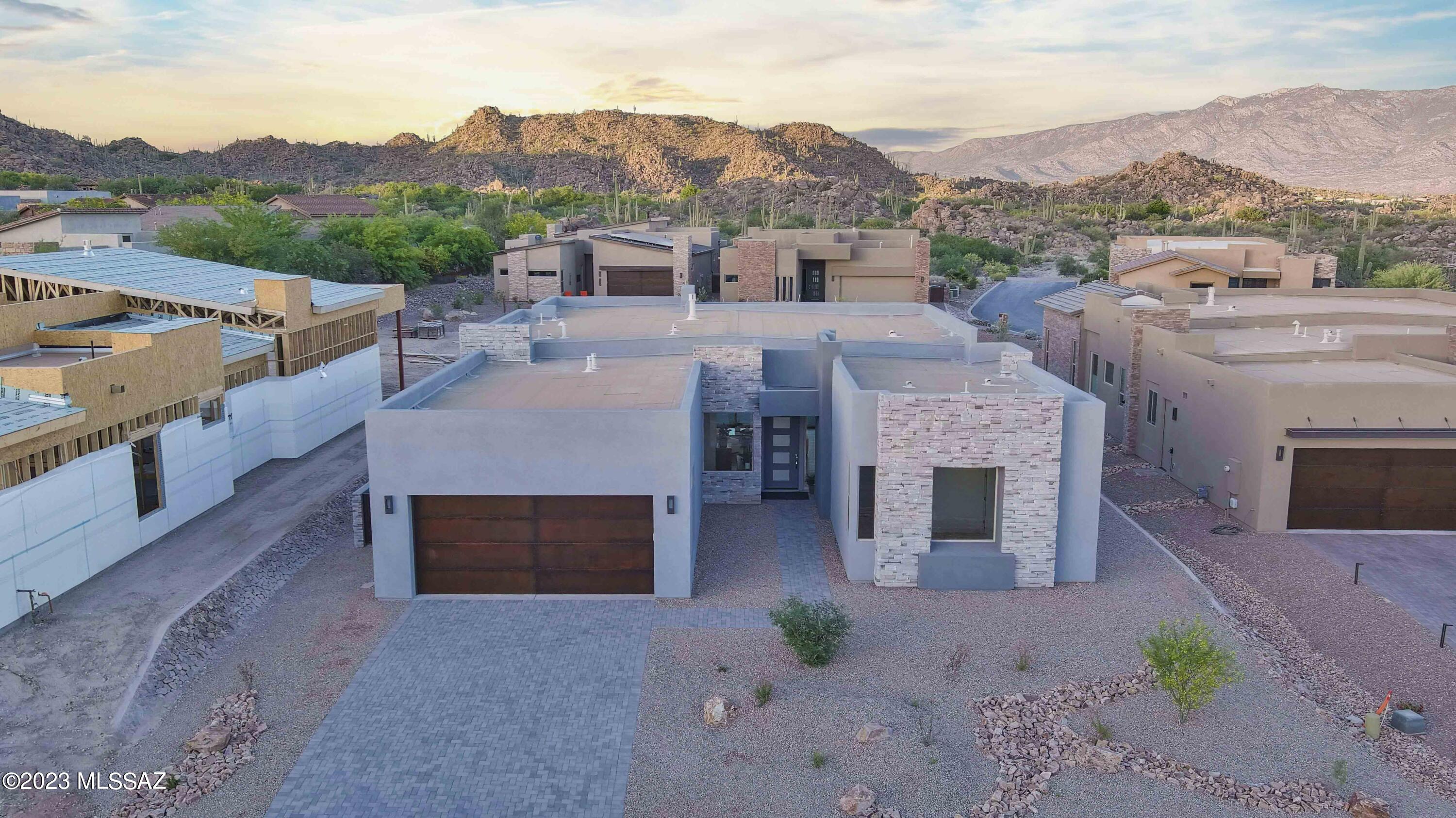 One of the LAST AVAILABLE opportunities to buy in the Enclave! Set in the Stone Canyon guard-gated and luxury golf course community, this contemporary 3 bed, 3.5 bath home is exquisite. Your own distinctive, private enclave nestled in the high Sonoran desert, this state-of-the-art residence is a masterpiece of modern living. Within walking distance to the Stone Canyon Health and Fitness Center, Golf Course and Clubhouse. Take advantage of the tennis courts, pickle ball, lap pool and golf course designed by Jay Morrish. Gorgeous designer finishes and a huge backyard make this an incredible opportunity to own a new home in the Enclave.