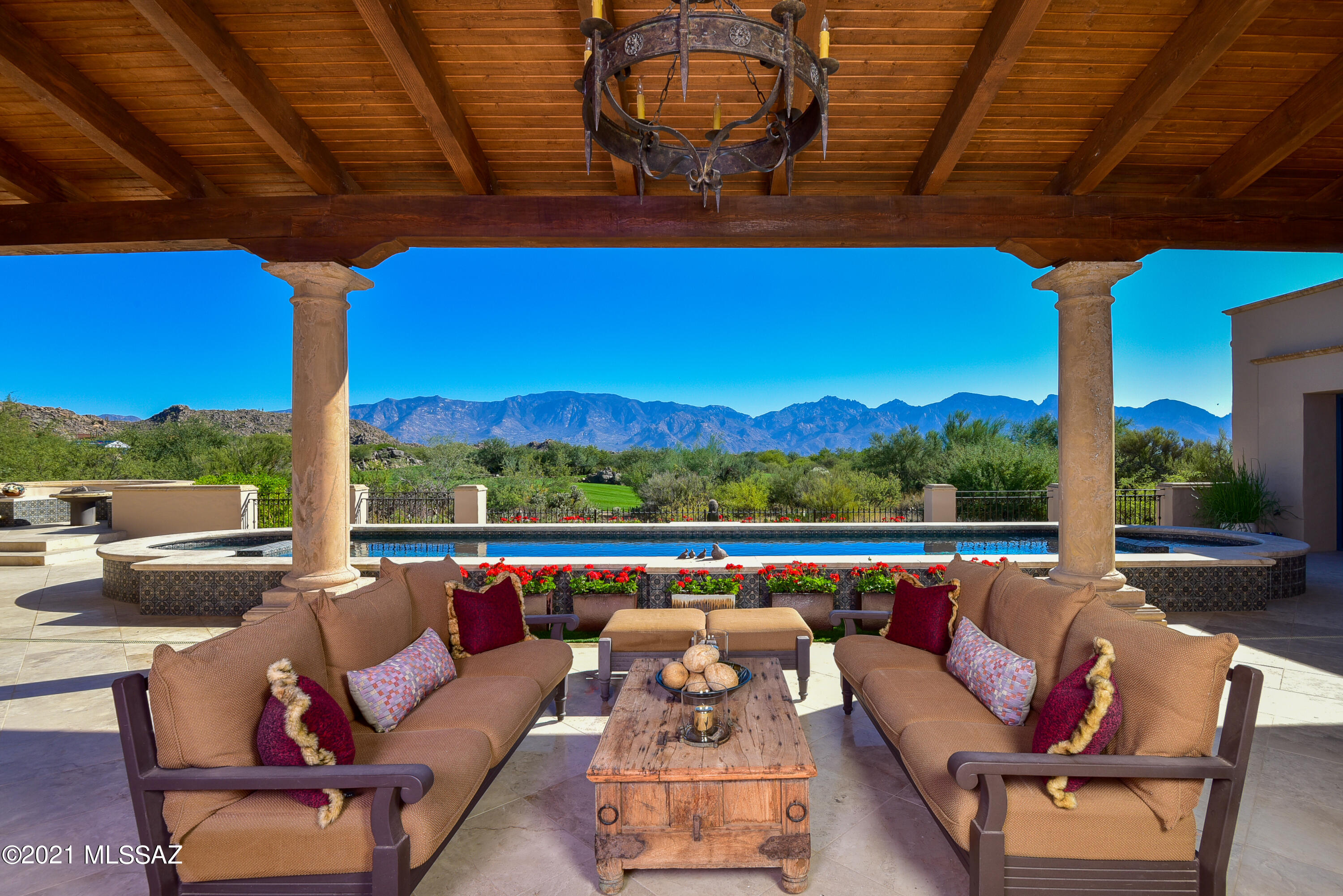 Inspired by Tucson's iconic Arizona Inn and set on fabulous view lot overlooking Stone Canyon's course with panoramic views of Catalina Mtn range! Spectacular Santa Barbara style, 5,571 SF plus 576 SF quest house (4BR, 5BA, Library/Media, Office, Exercise & Observatory) in exclusive guard-gated Stone Canyon. Entertainment-oriented great room with central bar kitchen & scullery flanked by dining & living areas. French doors open accordion style to deep cov'd terrace with full BBQ kitchen, 2-way Fpl to Lounge, lap pool, spa & firepit. Galleries for art, 2x2 limestone & reclaimed wood floors, 6 Fpls, solar, Crestron system, circular drive. Ron Robinette architecture, Lori Carroll design, Willmeng Homes masonry construction. Exquisite finishes, finest materials, totally private. Owner/Agent (See Documents Section for Details & Features)