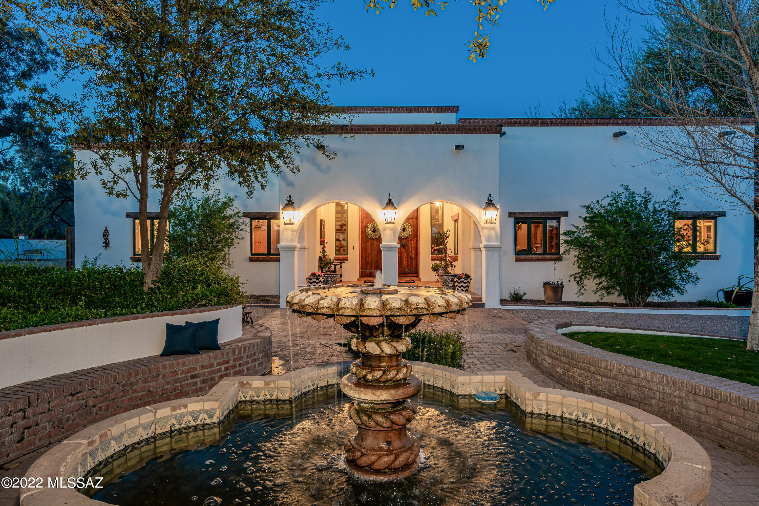 Welcome to this truly spectacular Tucson home! A stunningly picturesque estate nestled in a shady mesquite bosque. Custom built by renowned builder Mark Butler, this quintessential Tucson home has been featured in Tucson Home and Garden, The Opera Tour, and various Tucson news publications.

Situated on over 3 acres of native mesquite growth in one of Tucson's loveliest hidden corners, this true Spanish Colonial style home boasts rustic hand-carved wood beams, countless arches & French doors, saltillo tile floors, cantera & talavera fountains, expansive courtyards & covered patios, and a luxurious pool long enough for lap swimming. The exquisite master suite boasts a cozy fireplace, large walk-in closet, and newly remodeled ensuite bath. The guest/pool house provides ample room for friends and family and features a tranquil steam room for maximum relaxation. The spacious 2nd and 3rd bedrooms offer a Jack & Jill bath along with peaceful window seats overlooking the placid backyard. 3-car garage and sumptuous home gym with natural light and large mirrors. This 3.3-acre stunner is an entertainer's dream. Welcome home, you're never going to want to leave!