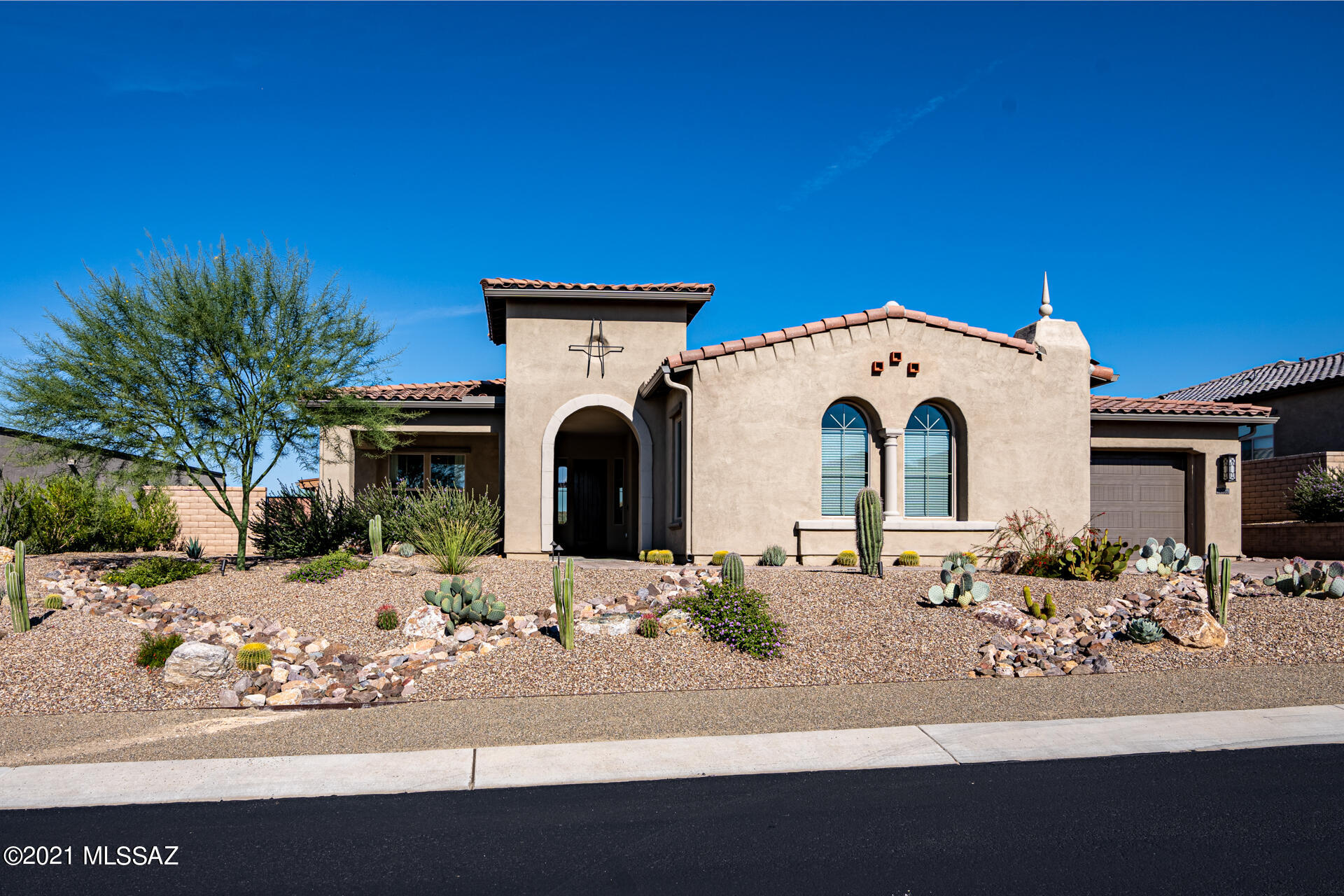 TURNKEY Toll Brothers at gated Los Saguaros Dove Mountain. This custom designed estate with modern touches was completed just 2 years ago, nestled behind private gates on a premium lot backing to common area. The Ritz Carlton Hotel, Gallery Golf & Fitness Club & Dove Mountain Golf Club just minutes away. A well-designed Great Room floorplan showcases 3113 SF & offers 3 bdms, Den, 3 baths plus Unfinished Casita/Garage. This stunning home features professionally designed interior w/ premium finishes, custom furniture, window coverings and furnishings all included. A spectacular pool & spa, 2 covered patios, fireplace & tournament Bocce ball court complete the resort style backyard. This Turnkey Masterpiece is ready for immediate occupancy, all the work has been done. It's move in ready! Wall hung artwork, personal items & Kamado grill on patio do not convey. R/O water filter under kitchen sink & water softener system are leased from Culligan and do not convey.
