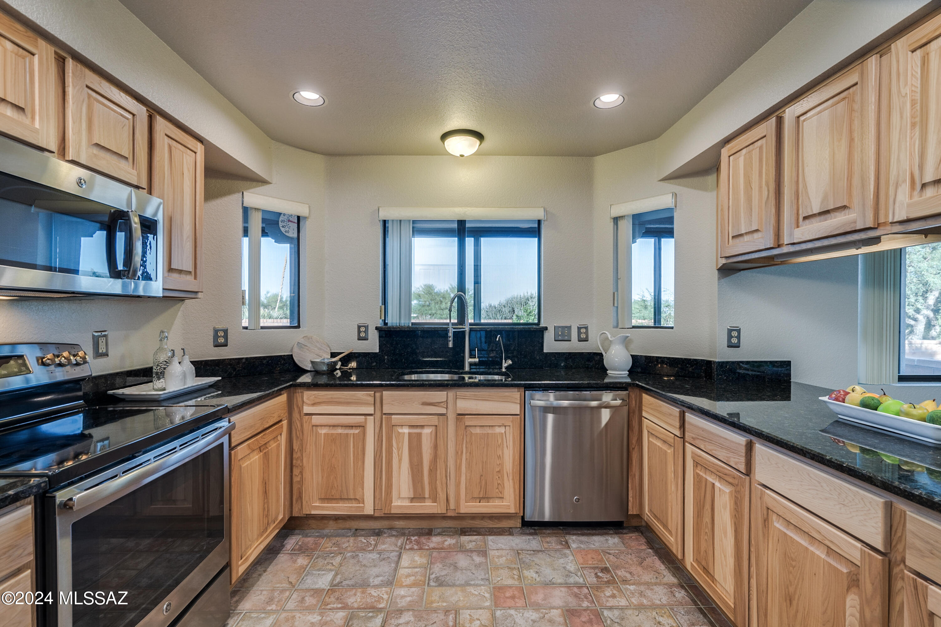 Discover your perfect retreat in Green Valley's Ventura West at Las Campanas! This meticulously maintained home is not just move-in ready - it's a gateway to the vibrant 55+ lifestyle you've been dreaming of. Step into a world of comfort with a welcoming front courtyard and a private, screened-in back patio that offers breathtaking views of the Santa Rita Mountains.
Nestled on a generous .19-acre lot with low-maintenance landscaping, this property boasts no direct rear neighbors, ensuring your privacy and tranquility. Inside, you'll find a freshly painted interior adorned with new carpeting and modern appliances. The spacious two-bedroom, two-bathroom split floorplan layout features a large primary suite with direct access to the backyard patio, perfect for enjoying those mountain
