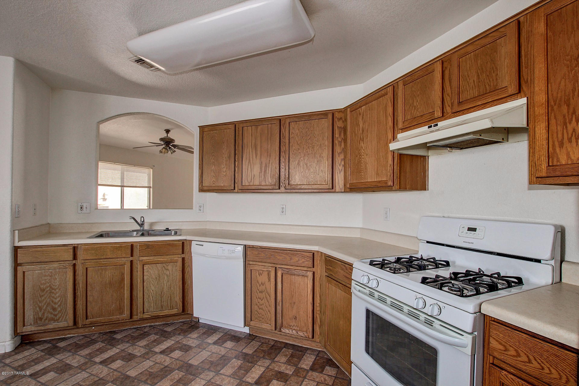 Welcome to your new home! This 3 bed, 2 bath home has vaulted ceilings, flexible interior palette and laminate throughout. The kitchen has built-in pantry, white appliances and a plethora of cabinets for convenient storage. Both spare bedrooms have built-in closet, ceiling fans and plush carpeting. The master offers private bath and generous walk-in closet. Enjoy endless blue skies underneath the covered patio and worry free landscaping. Call now for a showing!