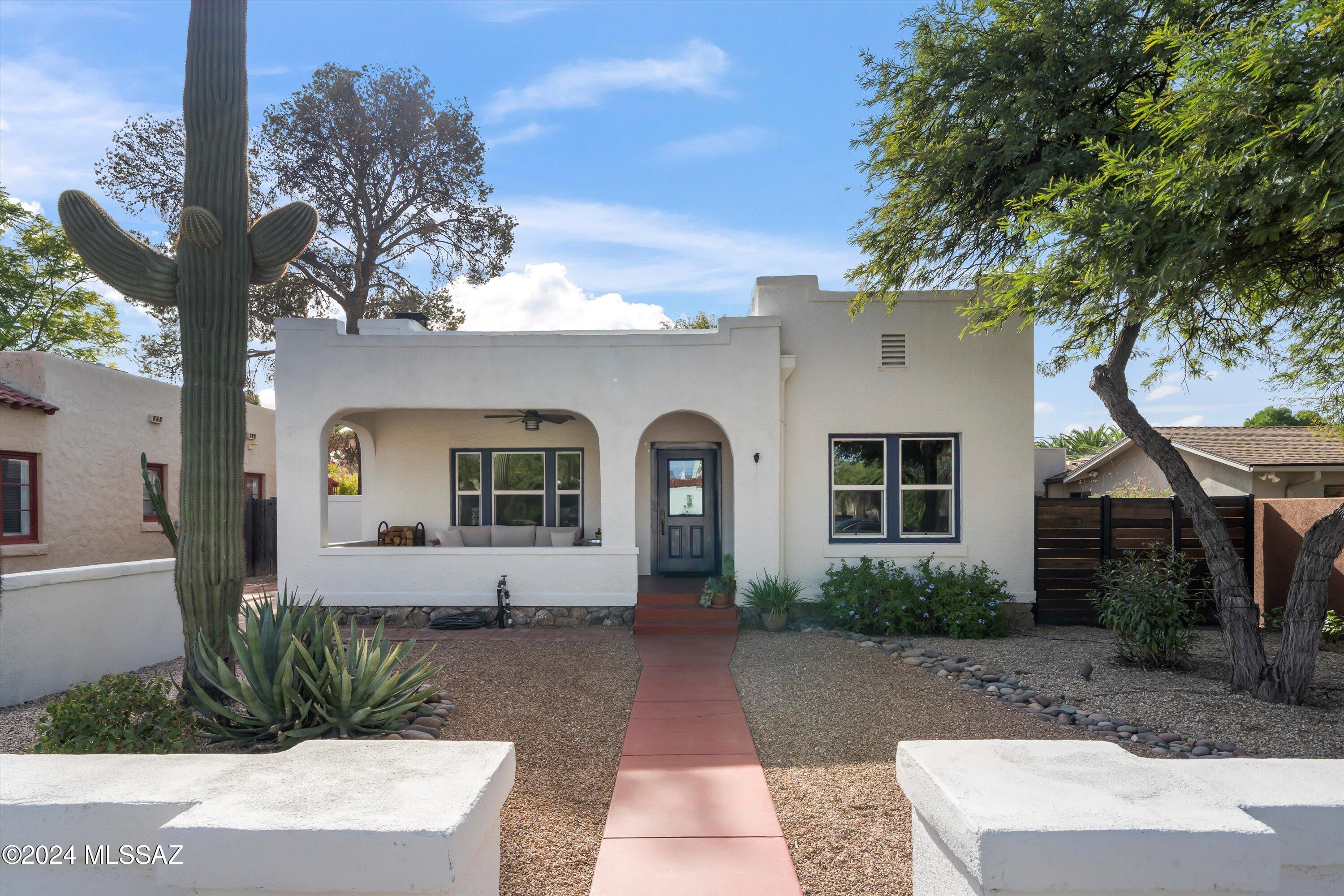 Gorgeous Historic 3 bed 3 bath Bungalow nestled in the heavily sought after Sam Hughes Neighborhood. Completely remodeled with numerous tasteful upgrades. This charming home is in the heart of Tucson and a stone's throw to the University of Arizona.  Eye candy throughout entire home with Natural wood flooring and exposed brick. Fully finished basement with multiple windows for great ambient natural lighting, Renovated kitchen featuring custom floor to ceiling shaker cabinets, farmhouse sink, granite counters, and stainless appliances. Anderson windows and doors. Roof recoated in August 2024. Tankless water heater, and potassium water softener.  The yard is a private oasis.  Plans completed for additional dwelling unit and ready for permitting. NO HOA! A Must See...This home will go fast!