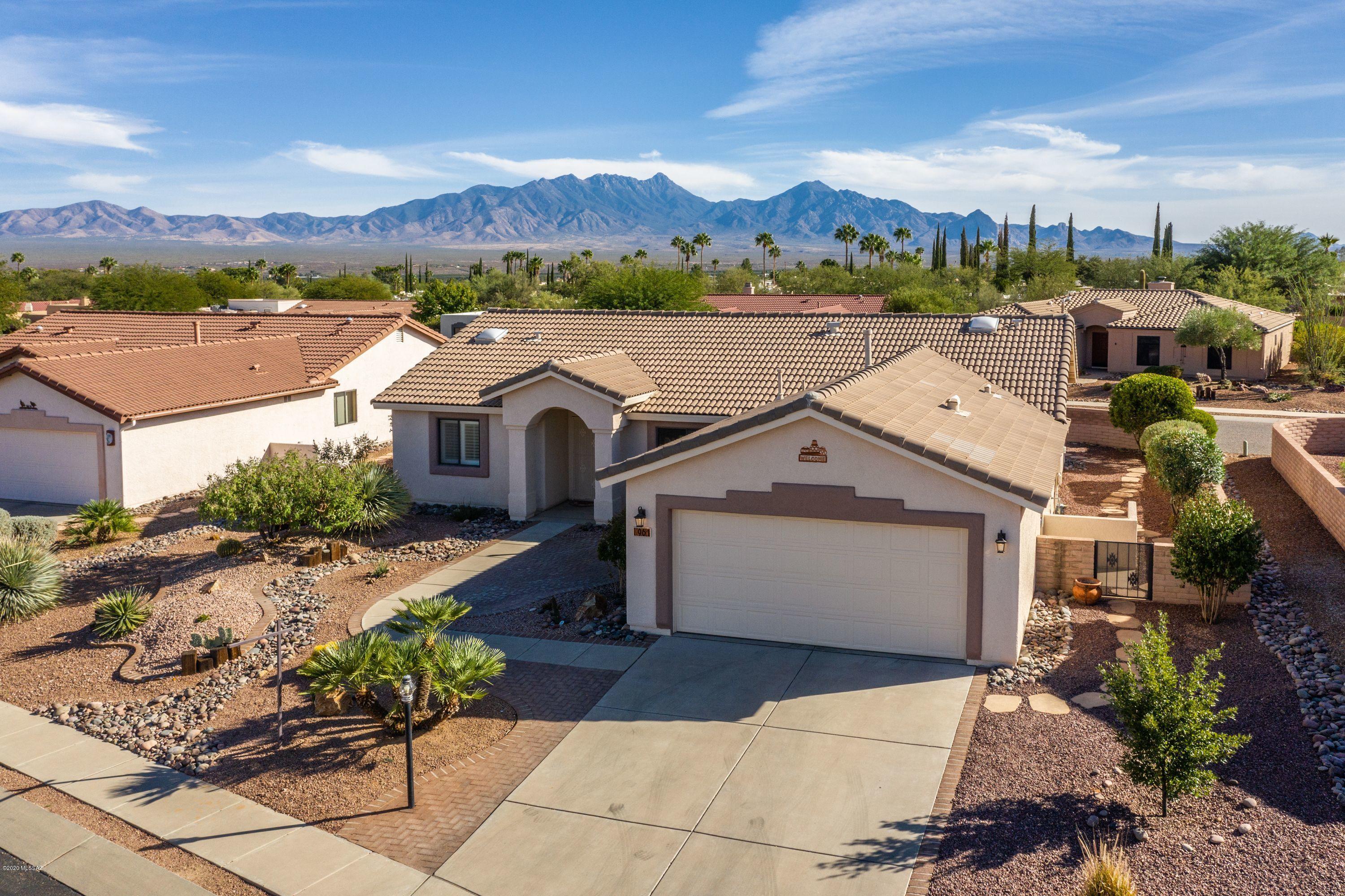 Beautiful views of the Santa Rita Mountains! Located close in to the town center, farmers market, restaurants and shops.  This home features an updated kitchen w/granite counters and modern tile backsplash, an adjoining eating space, spacious living area,2 bedrooms, 2 baths, den, hobby area, Arizona room and a double car  garage with lots of cabinets. Lovely outdoor spaces to enjoy the Mt and Desert views!
Seller to pay for 1 yr Home Warranty Plan.