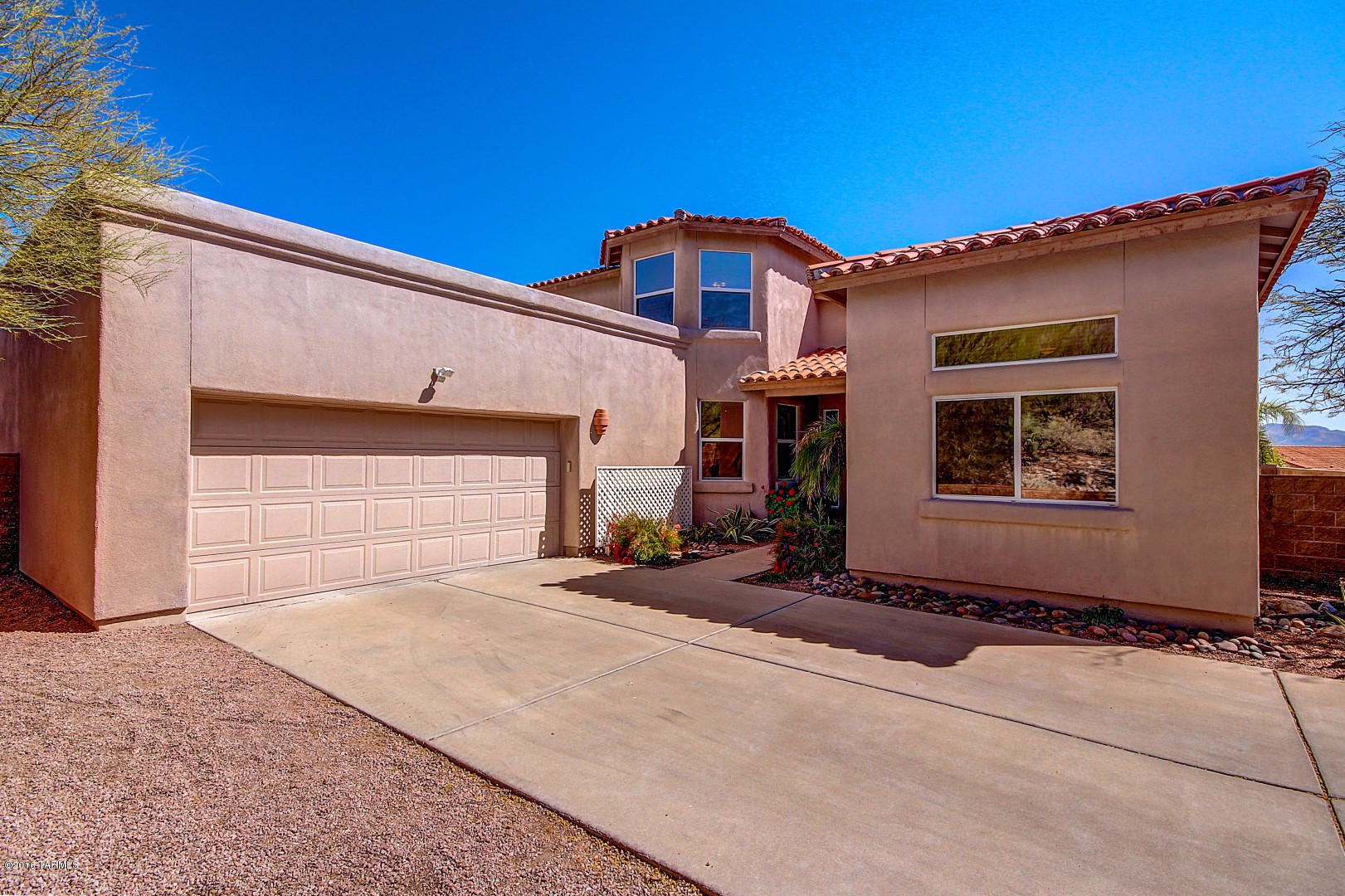 Outstanding Home with Majestic Mountain Views. Granite counters, tile floor, hardwood floor, and plush carpet in all the right places. Art niches, recessed lighting, window blinds, upgraded lighting/ceiling fans, and soothing interior palette. Cozy fireplace, French Door to patio, media alcove, built-in shelves, and soaring ceilings. Spacious Den/Office or formal dining, bedrooms,  and plenty of closets. Resort style backyard with covered patio. flagstone patio, decorative fountain, refreshing fenced pool, swaying palm trees, and endless blue skies. Gorgeous mountain views from every bedroom make it  A must see Home!