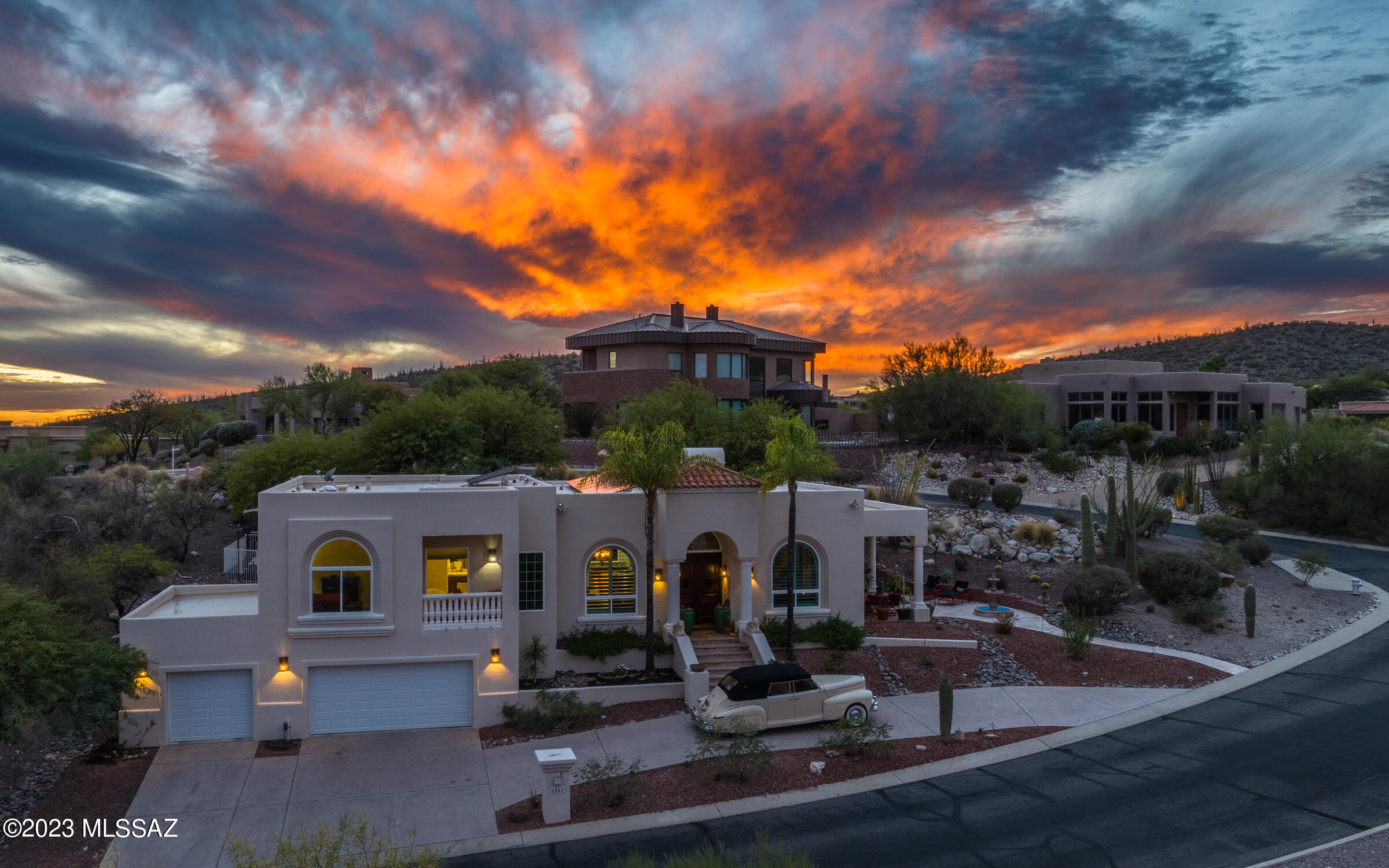 Elegant foothills retreat in the gated ''Ridge at Ventana Canyon''.  Sited to capture expansive mountain views.  True great room floorplan for a casually elegant lifestyle. Island kitchen is well equipped with walk in pantry, and lots of storage space and is the perfect place to gather. The primary suite will not disappoint: WI shower, soak tub, large WI closet. The Jr Suite includes WI closet /full bath. Three car garage features good storage/work areas and has a convenient inclinator to carry groceries & more.  Lots of outdoor areas to enjoy the high desert vistas and a dip in the private hot tub. New energy efficient windows/doors throughout, Solar System is owned. Ventana Canyon Resort and Country Club is minutes away. Fine shopping and restaurants are all within an easy drive.