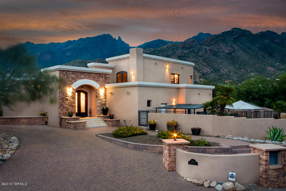 This elegant home is solar powered and offers privacy and custom appointments including gourmet kitchen with stainless steel appliances, Wolf stove top gas range, Bosch dishwasher, large entertaining serving areas, deep kitchen pantry, and wet bar. Master bedroom retreat with private courtyard, large dressing rooms and exercise room. Stunning remodel and renovation of entire home in Nov. 2007. Spacious 4 car garage and shop area. On demand tankless hot water. Choose between 2 private offices and enjoy views from the living room area leading you through the 12 foot retracting glass doors to your backyard private retreat and heated salt water pool area. Enjoy the brilliant mountain and city views, landscapes, balcony sun deck, patio pavers, stately flagstone accents.