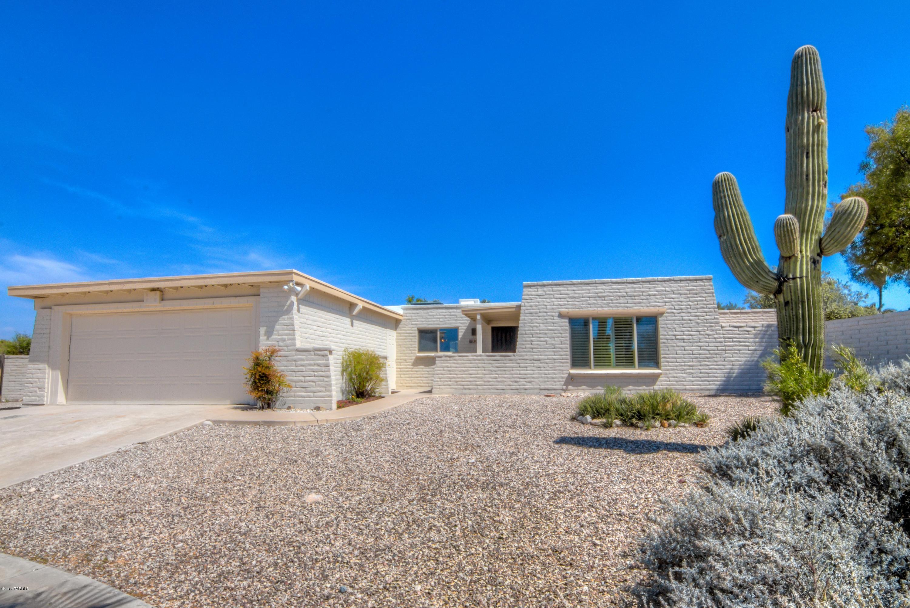 RANGE MARKETING-Seller accepts/counters offers $249,900-265,000. Newly remodeled east side home w/ pool. 3 bedroom, 2 bath, w/ den that could be 4th bedroom, living room, family room w/ fireplace, & kitchen eating area! New tile flooring. Lots of natural light throughout! Upgraded ceiling fans & lighting fixtures! Open kitchen features granite counters, stainless steel appliances, & spectacular custom wood cabinets w/ stylish hardware. Plush neutral carpet in bedrooms. Upscale bathrooms boast designer tile, fixtures, lighting, custom wood cabinets w/ quartz counters. Awesome mountain views from HUGE backyard! Coverage patio. 12x16 detached storage shed. Plenty of room to park RV, boat or toy haulers. Newer AC unit. New double pain windows thought out. Newly coated roof w/ roof warranty.