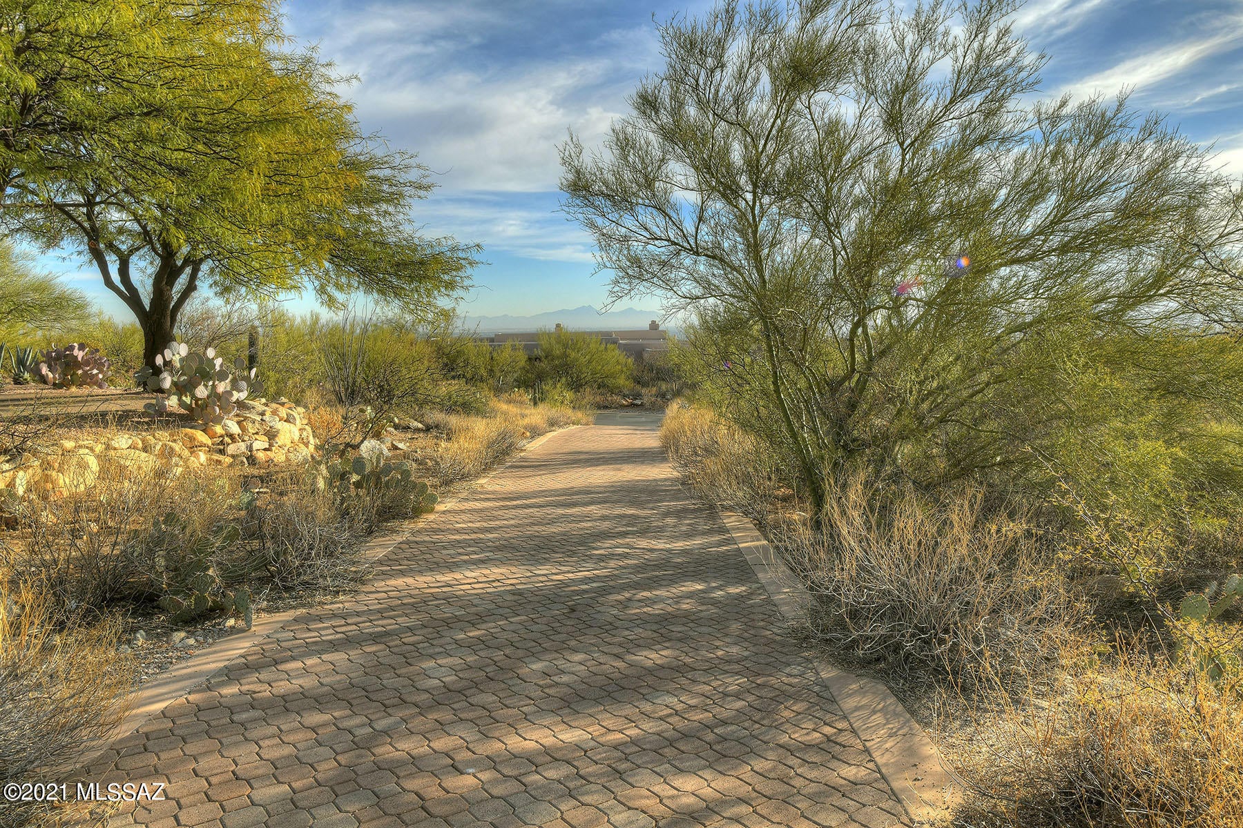 Amazing 1.76 acre very private homesite with magnificent mountain
views in prestigious gated Pima Canyon. Builders and owners will love the easy building site with a long brick paver driveway already there.