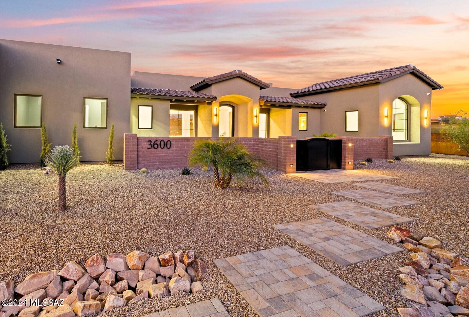 Ready NOW in Gated Colonia del Sol. Stunning New CONTEMPORARY by Simmons Home Designs, Axios Builders and Interior Design  by Architectural Touch, LLC. Perfectly Sighted to capture outstanding Mountain Views. Elegant Design & Superb Finishes. Pella Window Package, featuring 30 Ft Sliding Door System at Great Room. Superb Kitchen Design w/ 48'' Wolf Duel Fuel Range, Sub-Zero Refrigerators, Generous Marble Island & Sophisticated European Style Cabinetry.  Elegant Exterior Design w/ Tumbled Paver Driveway & Silver Travertine Patios/Pool Deck. Heated Pool/Spa, 2 Outdoor Firepits & Spacious Covered Patio.  Stunning Great Room  w/ Vertical Wood Accent Wall & Sleek  72'' Linear Gas Fireplace. Luxurious Primary Suite w/ Oversized Walk-in Closet. 2 En-Suite Guest Bedrooms & Stunning Home Office.