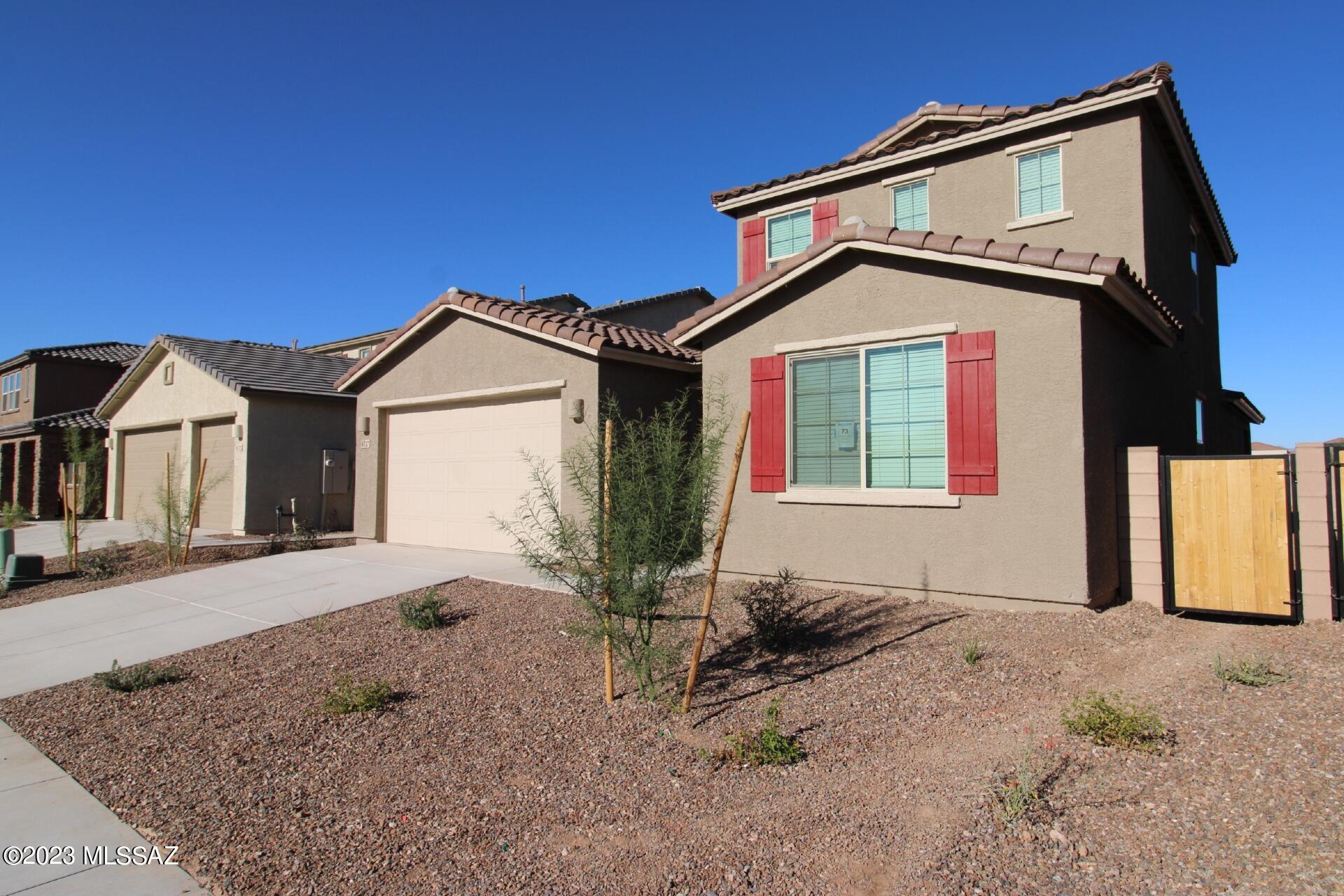 **** $1050 credit ($300 from landlord and $750 from Owner) - if moved in by January 22nd**
2802 SQ FT! 5 bedroom, 3 bath home in La Estancia De Tucson! Be the 1st to occupy this brand new home. Thoughtful two-story floor plan! Stunning eat-in kitchen with included appliances, & expansive center island/breakfast bar. Open concept living/dining with sliding door patio access! Great for indoor/outdoor entertaining. Neutral interior with luxury tile flooring in all the right places! Spacious upstairs loft provides ample additional living space + flexibility. This home offers 5 generously sized bedrooms, 4 out of 5 located downstairs! Downstairs primary suite with full bath + walk-in closet. Upstairs secondary bedroom with optimal privacy! Blinds. Laundry room with included washer/dryer!