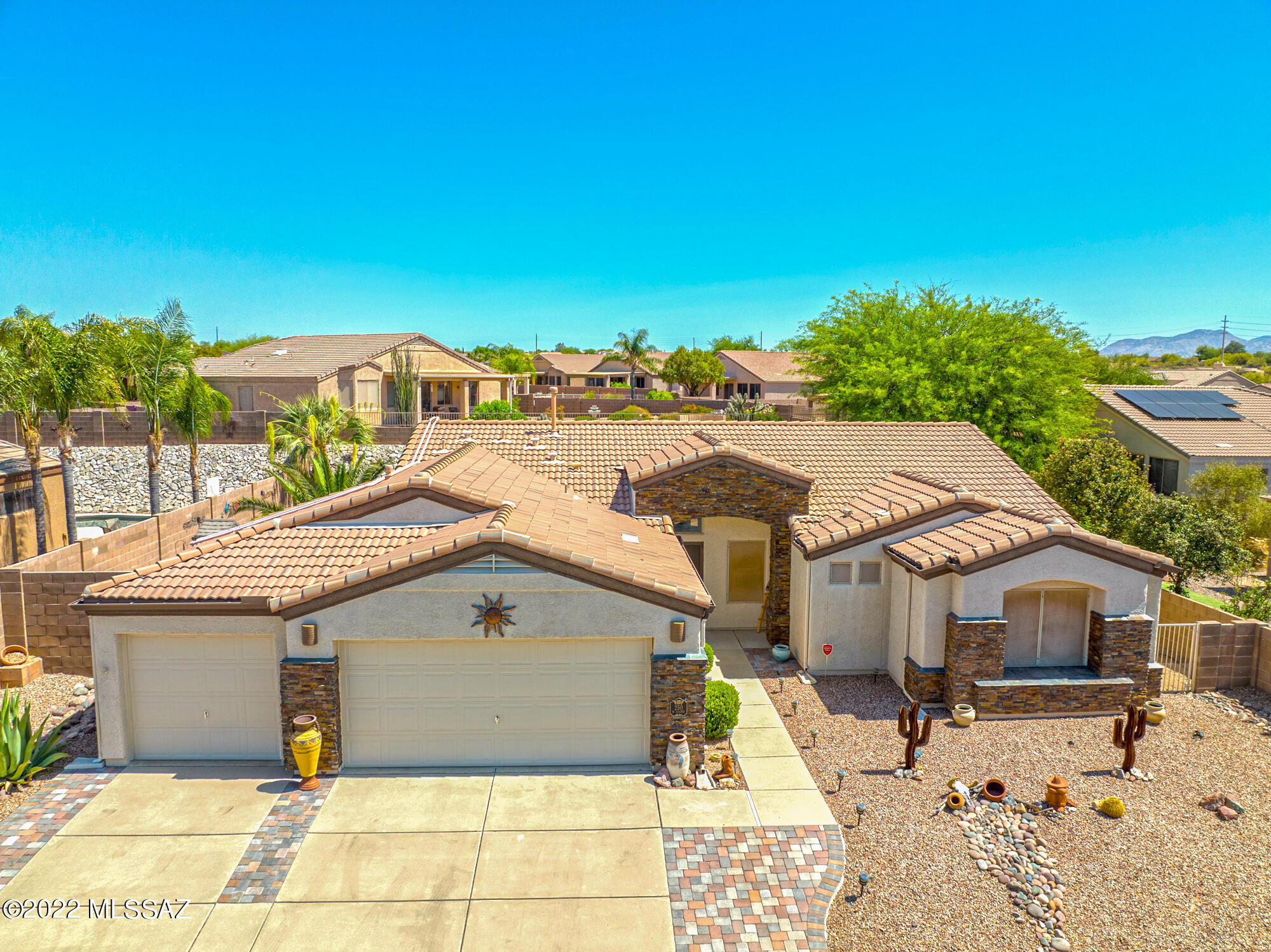 Seller to entertain/counter offers between $500-550k. Perfectly situated in the desirable Monterra community with scenic mountain views, this inviting home features handsome updates inside and out! Beautifully finished exterior with stacked stone accents, custom paver walkways and patios, and a tranquil backyard retreat with solar-heated pool. Generous split-bedroom floorplan features vaulted ceilings, an easygoing great room design, and light-filled kitchen with center island, granite counters, designer backsplash, and ample storage/workspace. Deluxe primary suite and custom-finished ensuite bath featuring dual vessel sinks and an oversized walk-in shower with multiple showerheads and stunning tilework. Bonus 5th bedroom makes it easy to accommodate guests, a home office, or hobby space!