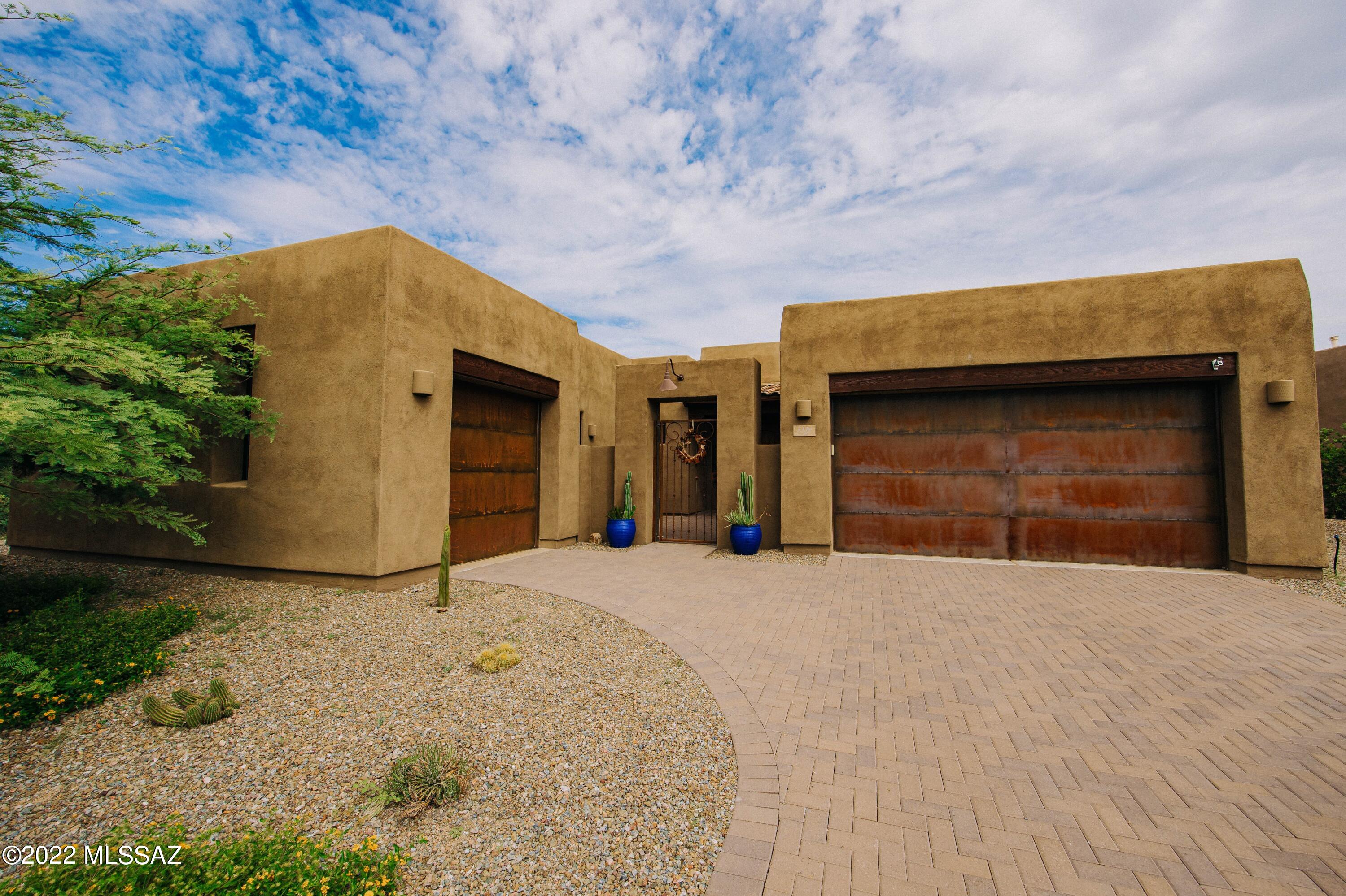 This luxurious Insight home located in the gated community of The Preserves at Dove Mtn. features impeccable finishes and upgrades throughout, from beautiful, tongue and groove ceiling, to gorgeous stained concrete floors.  Enter your new home through the private gated courtyard.  This home, for the chef and entertainer at heart.  The kitchen has state of the art appliances, beautiful granite, alder cabinets and pendant lights that may just be art.  Open floor plan with grand windows that show you the vistas and wonders of the desert.  Windows have 3M tint.  Guests suite has a private entrance to the courtyard and solar tube skylights.   Enjoy your oasis backyard by lounging in the pool with the water feature and spa during the day or watching the Arizona sunset by the fire bowl feature This house is very energy efficient with a solar system that is owned, not leased. The Average electric bill for the last 12 months is only $88.26/month! The Listing Agent is related to Sellers.