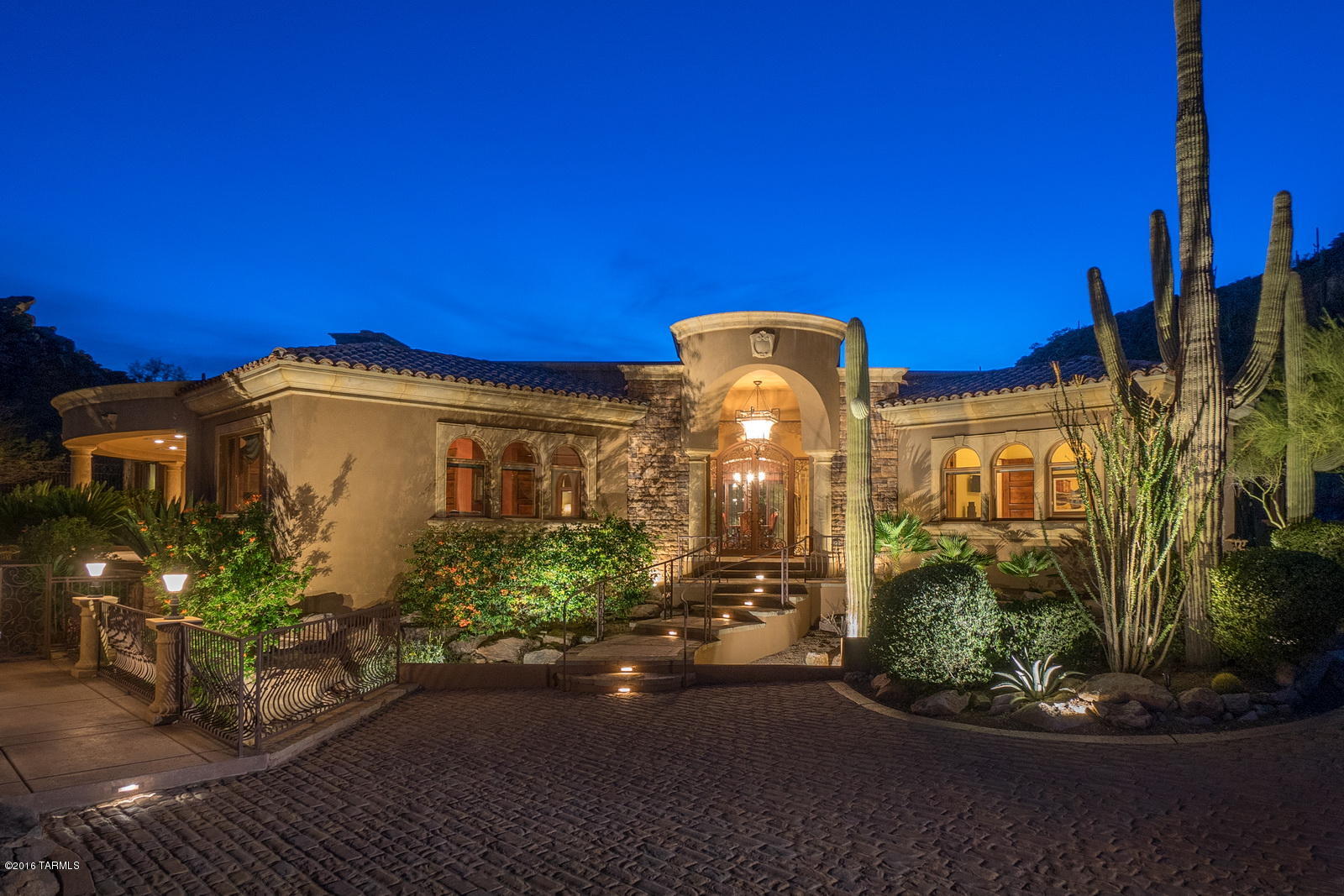 Located behind the gates of Canyon Pass, this spectacular estate is situated on one of the most impressive lots offering sweeping Tortolita & Pusch Ridge Mtn views along w/ City Lights. This Mediterranean beauty was designed for sophisticated entertaining or casual living. Gourmet kitchen w/ custom cabinetry, granite, Dacor double ovens, 6-burner gas stove, Sub-zero fridge, 2 Bosch Dishwashers, & large pantry. Features collapsing sliding doors to showcase the very best of indoor/outdoor living. Master retreat has 2 large walk-in closets, heated soaker tub, FP, & walk-in shower w/ multiple shower heads.Backyard oasis has travertine, fireplace, misting system, ceiling heaters, fire pit