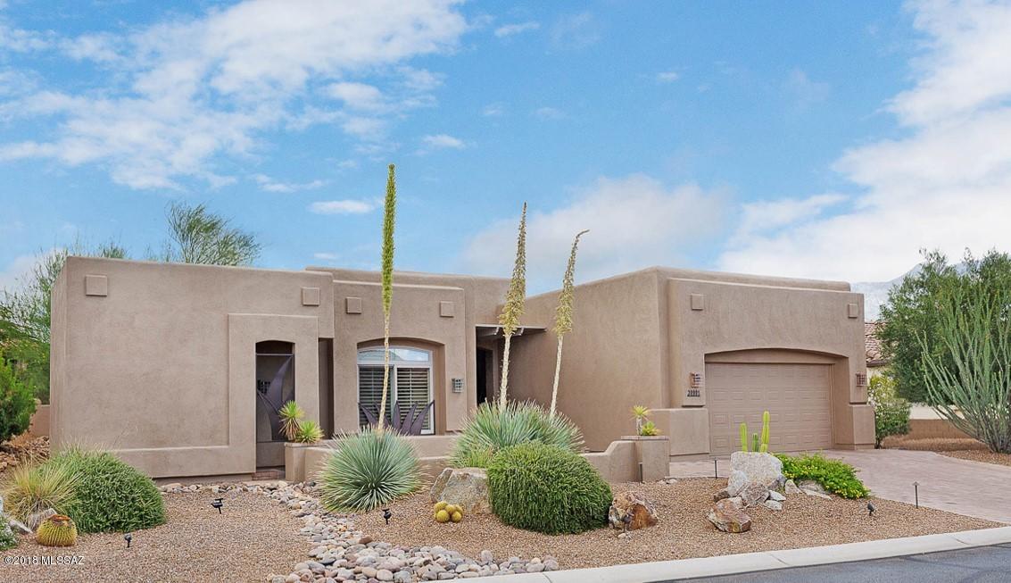 This Home is Such a Delight, Come See for Yourself.  Owner is Interior Decorator and Has Designed 2008 Santa Fe Style Home Beautifully.  Updated, Expanded & Upgraded. 2030 sq. ft. (See Floor Plan) Intended to Charm You with Great Planned Living Spaces. 4 ft. Extended Garage with Enough Property Next Door in Side Yard to Add A Full Size Garage or A Golf Cart Garage with Approval of HOA. Offering Mountain Views, A Spa, 4 Fireplaces, 2.5 Baths, 3 Bedrooms with Ensuite Baths. Extensive Landscape Pavers, Decorative Coronado Boulders, Hunter Douglas Silhouette Blinds, Plantation Shutters, Granite & Quartz Counters. Upgraded Additional Overhead Lighting Through Out.  Custom Entry Gates with Decorative Window Accompaniments. Located Near Tennis, Fitness Center, Swimming Pool & Dog Park.